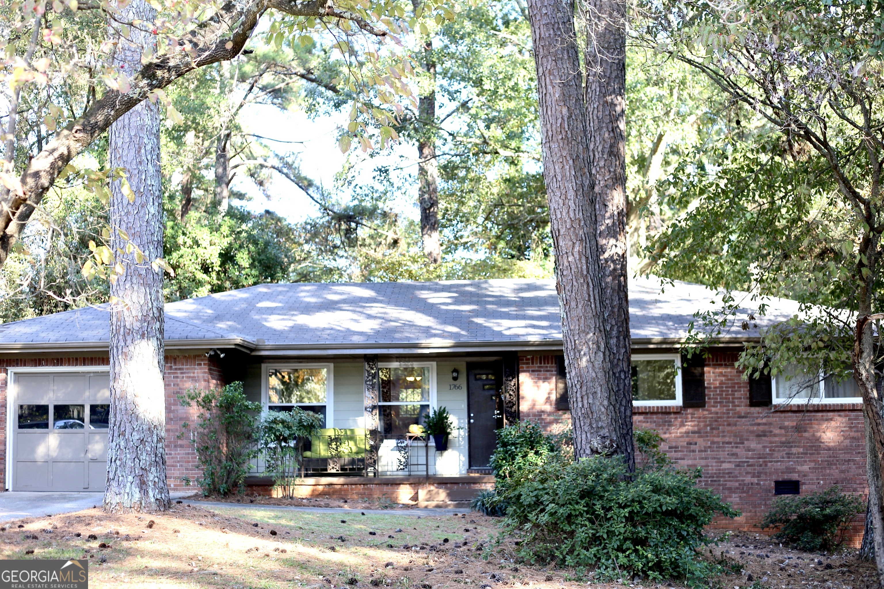 This charming brick home offers timeless curb appeal with a classic four-sided brick exterior, mature trees, and a cozy, covered front porch-perfect for enjoying your morning coffee. Inside, the bright and airy living spaces feature soaring ceilings and gleaming hardwood floors throughout, adding a touch of elegance to this spacious three-bedroom, two-bathroom gem. The kitchen has been beautifully updated with new stainless steel appliances, an undermount sink, and solid wood cabinetry, providing both style and functionality. The master bathroom is a retreat with beadboard detailing, ceramic tile, and a tub/shower combo that fills with natural light from the thoughtfully placed window. Ample closet and storage space are available throughout, while the freshly painted trim and 2021 HVAC system offer peace of mind. The laundry room has additional storage for added convenience, and the fenced backyard with an open patio is perfect for entertaining or enjoying outdoor activities. The one-car garage and welcoming sidewalk add to the home's accessibility and charm. Ready for you to move in and make it your own! 1766 Austin Dr. in Decatur, GA is surrounded by a variety of convenient attractions and activities. Just a short drive away, you can visit Decatur Square, a lively area filled with shops, restaurants, and live performances, making it ideal for a leisurely stroll. For outdoor enthusiasts, Mason Mill Park offers scenic trails, tennis courts, and bird-watching opportunities. Families can enjoy First Christian Church of Decatur's Community Park, which features a playground and plenty of green space. For dog owners, there are nearby dog parks like Adair Dog Park and Oakhurst Dog Park, offering shaded areas for pets to roam. Decatur's vibrant cultural scene also includes live music venues, breweries, and art spaces, making it a diverse place to explore year-round.