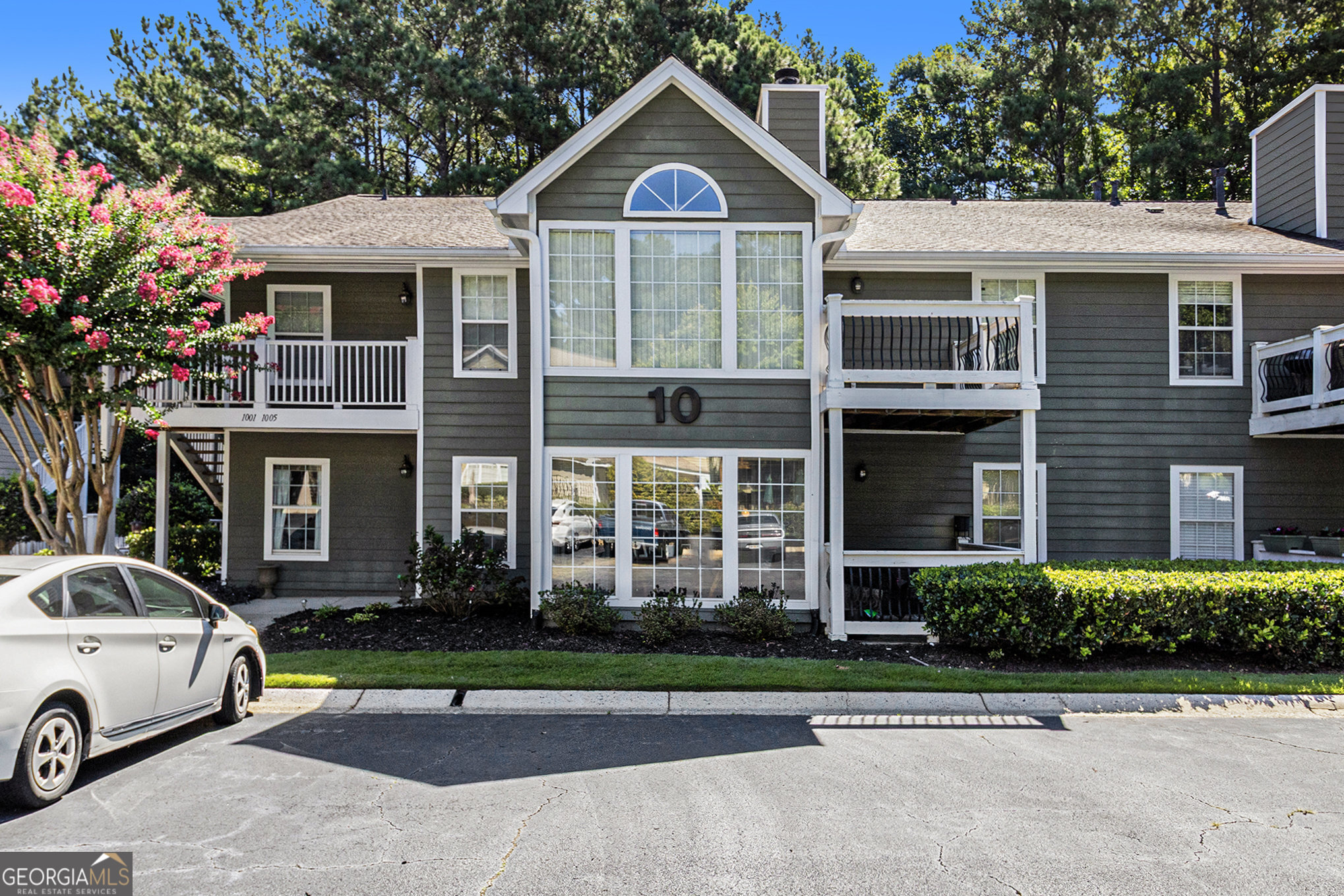 Welcome to this charming 2-bedroom, 2-bath lower-level end-unit condo in the friendly Berkeley Woods community. This thoughtfully designed home features a desirable split-bedroom floor plan, perfect for privacy and flexible living. Step into the bright and airy sunroom at the front entrance-an ideal spot for morning coffee or a cozy reading nook. The main living areas feature newly installed laminate flooring, and the side porch offers a quiet outdoor retreat. With its functional layout and inviting atmosphere, this home is ready for you to make it your own. Conveniently located near shopping, dining, and major highways, this condo offers comfort, convenience, and a welcoming community feel.