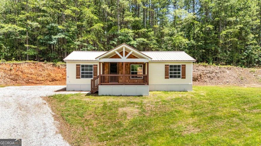 SELLER WILL PAY $5,000 towards closing costs with their preferred lender! FHA / CONV / VA and interest rate buy down available!  Charming Renovated 2 Bed / 2 Bath Mobile Home with  permanent foundation on .84 acres in Fairmount, GA!  Welcome to your perfect blend of peaceful country living and modern convenience! This beautifully renovated 2001 mobile home offers 2 spacious bedrooms, 2 full bathrooms, and sits on a generous .84-acre lot with no HOA or restrictions-giving you the freedom to make it your own!  With approximately 980 sq ft of thoughtfully updated living space, this home is ideal for first-time buyers, owner-occupants, or investors looking for a great rental opportunity. Step inside to find a light and airy open floor plan featuring new LVP flooring throughout, fresh interior paint, modern trim and fixtures, stylish tile work, and a custom backsplash in the kitchen.  The large living room flows seamlessly into the kitchen, creating an inviting space for entertaining or relaxing. Both bedrooms offer their own private bathrooms, providing comfort and privacy for family or guests. A separate laundry room adds convenience to daily living.  Enjoy your morning coffee on the covered 14x8 front porch, or step out to the 4x5 back stoop and take in the beautiful open yard-perfect for gardening, outdoor activities, or future expansions.  Located in Fairmount, Georgia, this home offers the best of both worlds: tucked away in the quiet countryside, yet conveniently positioned between Highways 75 and 515 for easy access to shopping, dining, and travel.    Don't miss this move-in ready gem-schedule your showing today and explore all the possibilities this wonderful property has to offer!