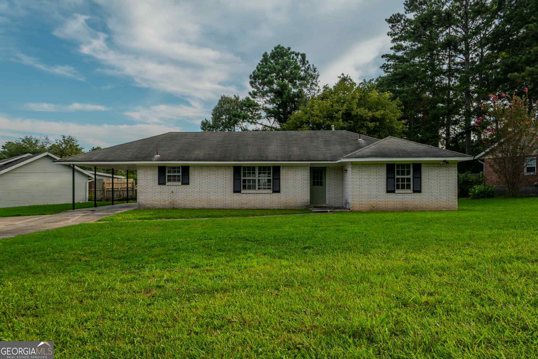 **Move-In Ready 3-Bedroom Brick Ranch on a Large Corner Lot!** Discover comfort and convenience in this well-maintained 3-bedroom, 1.5-bath brick ranch, perfectly positioned on a spacious corner lot. Freshly painted throughout, the home features a bright, open-concept living and dining area-ideal for both daily living and entertaining guests. The generous front yard provides plenty of outdoor space, while the prime location offers easy access to Highway 85, Interstates 75/85 and 285, Tara Boulevard, schools, public transit, restaurants, and the public library. Whether you're a first-time buyer or downsizing, this charming home is a must-see! McMichael & Gray as closing attorney.