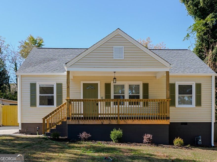 **Open House on Saturday, November 15th from 12 to 3 PM!  Welcome to this beautifully renovated bungalow that combines mid-century charm with modern comfort in the heart of East Point. Step inside to an inviting open-concept living area with new hardwood floors and natural light that fills the spacious living room-ideal for relaxing or entertaining! The adjacent dining room provides the perfect setting for hosting gatherings, while the updated kitchen boasts quartz countertops, shaker cabinets, and brand-new stainless steel appliances. The private owner's suite provides a serene retreat with an updated ensuite bath, while the additional generously sized bedrooms offer flexibility for guests, an office, or workout room. Enjoy morning coffee or evening sunsets from the newly added front porch. Perfect for unwinding and enjoying the neighborhood. Step outside to discover the true gem of this home-a large, flat lot! The private fenced-in backyard offers endless possibilities for outdoor fun, gardening, or an additional source of income with an ADU. Beyond the home's charm, recent upgrades include a new roof, a newly installed HVAC system, updated plumbing and electrical, all new single-hung windows, and a newly paved driveway, giving you peace of mind for years to come. Additionally, the unbeatable location places you minutes from the airport, major highways, and all that Atlanta has to offer. Don't miss the chance to experience this beautifully reimagined home and tight-knit community in person.