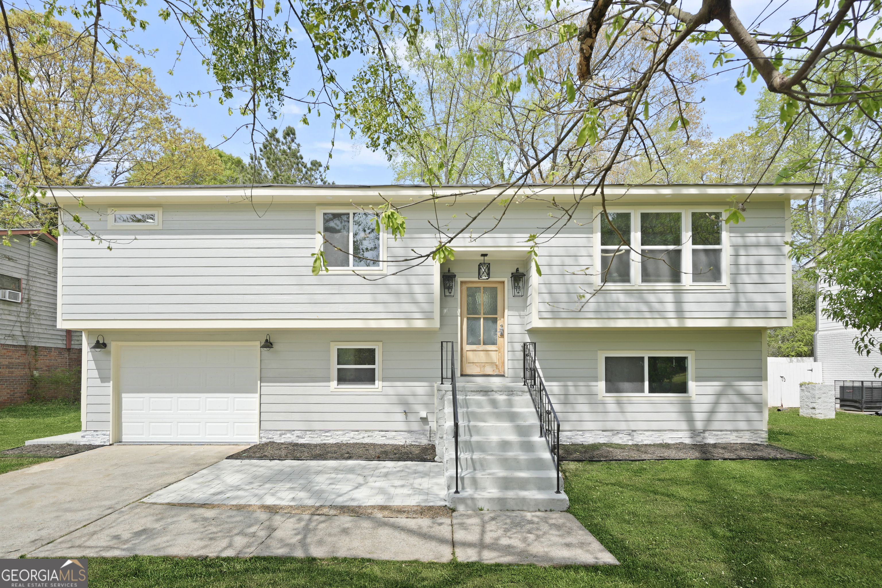 Zero Down Payment options are available along with a special 5% interest rate for Veterans! This fully renovated four-bedroom, three-bathroom home is a true showstopper just minutes from Hartsfield-Jackson Airport. Offering every upgrade imaginable, the home includes a washer, dryer, and all kitchen appliances, plus all staging furniture with the exception of the bed when purchased at full price. A 30-day closing is possible for buyers ready to move quickly. From the moment you walk in, you'll be impressed by the coffered ceilings, stunning light fixtures, and two fireplaces that add warmth and sophistication. The chef's kitchen is designed for entertaining and features an oversized island, pot filler, custom cabinetry, and access to a spacious deck overlooking a fenced backyard, making family nights and dinner parties effortless. Each bathroom has been beautifully tiled from floor to ceiling with luxurious, high-end finishes. The owner's suite is a true retreat with a soaking tub, dual vanities, a custom walk-in closet, and a one-of-a-kind tiled shower. The finished lower level offers flexibility with a private bedroom, full bath, and a flex room ideal for a media lounge or game room. Even the laundry room has been upgraded with built-in cabinetry. With no HOA, convenient access to Atlanta, and long-term value enhanced by the upcoming 2026 World Cup events, this home delivers both modern luxury and lasting appeal.
