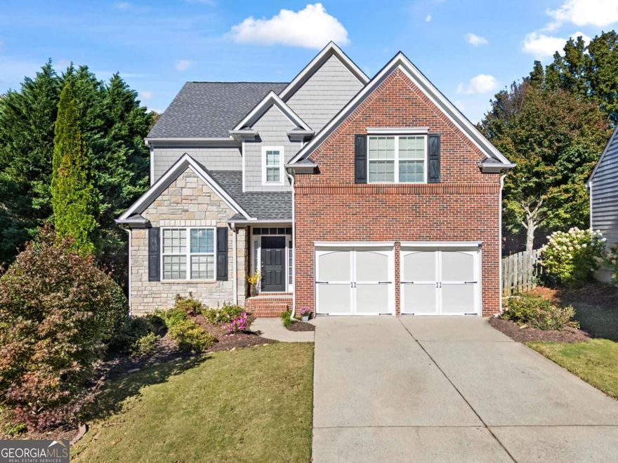 Welcome to highly sought-after James Creek in Forsyth County! This spacious 4-bedroom, 3-bath home offers 3,438 square feet of comfortable living space and sits on a full unfinished basement, ready for your personal touch. The east-facing orientation fills the home with natural light throughout the day, highlighting its well-maintained interiors and thoughtful design.    The kitchen features granite countertops, warm wood cabinetry, and ample counter space, perfect for everyday cooking or entertaining. Enjoy a private, wooded backyard that provides a peaceful retreat and plenty of room for play or relaxation.    The primary suite is a true retreat with a large bathroom featuring dual vanities, a garden tub, a separate shower, and two walk-in closets. Secondary bedrooms are spacious and versatile, offering plenty of room for family, guests, or a home office.    Recent updates include new top of the line HVAC system (2025), new water heater (2025), roof replaced in 2018 and new hardwood flooring.     Residents of James Creek enjoy resort-style amenities, including 12 lighted tennis courts, an indoor tennis facility, 2 swimming pools, a playground, and a fully equipped exercise center. Located in top-rated Forsyth County schools and benefiting from low county taxes, this home combines comfort, space, and an unbeatable community lifestyle.    Don't miss this opportunity to own in one of Forsyth County's premier neighborhoods!