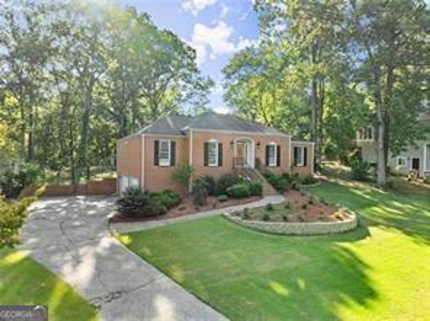 This is your new home! Located in the heart of east Cobb you will find this meticulously maintained brick ranch. Features include: 4/5 bedrooms, 3 full baths. Entry foyer, formal living room, great room with cathedral ceiling, brick fireplace & exposed beams, modern kitchen with breakfast area, ceramic tile, white cabinets, quartz counter tops, new stainless steel appliance package including gas range, dishwasher, and refrigerator. formal dining room, bright & open floor plan perfect for entertaining, huge sunroom with marble flooring and recessed lighting. On the lower level you will discover a stepless entry, marble floors, full bath, a complete second kitchen with new appliances including, electric range, microwave & dishwasher, center island breakfast bar, quartz counter tops, 4th bedroom with a media room or could be used for a 5th bedroom or even home office. Updates through out including HVAC system, private fenced back yard, gated access to the serene pond area located at the back of the property, 2 car side entry garage plus extra storage area. Do not miss this one.