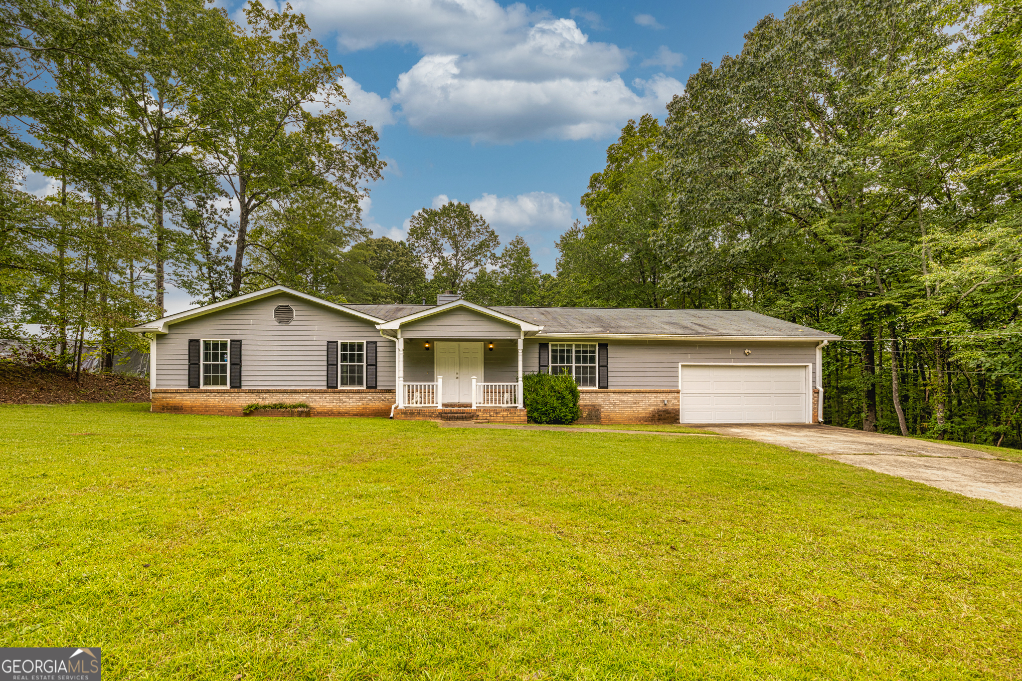 Discover the charm of Franklin living in this 3-bed, 2-bath ranch style home that sets on 5.36 serene acres. Offering nearly 2,000 sq ft, this home combines comfortable living with the beauty of the countryside.It offers a living room, family room and den! Perfect stone fireplace for cold nights and rainy days! Enjoy a spacious front and back yard, fresh air, and a slower pace of life, all while being minutes from local shops, dining, and schools. Perfect for those seeking privacy, room to grow, and the true essence of small-town Georgia living.