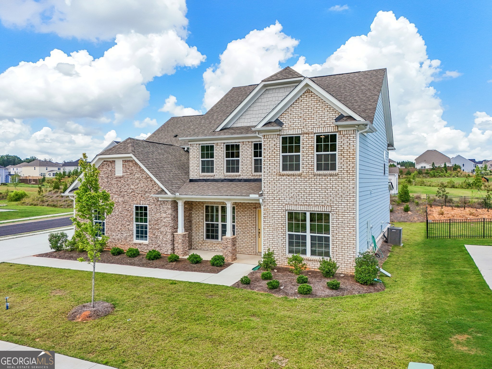 BACK ON MARKET - NO FAULT OF THE SELLERS!  Home is now vacant and ready for immediate occupancy!  Welcome to 152 Westberry Street!  This stunning 2022 built home offers modern living combined with classic southern charm.  Nestled in the heart of Peachtree City, this home offers both convenience and luxury.  As you approach, you'll appreciate the large corner lot and inviting curb appeal.  Step inside and be greeted by a spacious foyer that sets the tone for the rest of the home.  The open concept floor plan seamlessly connects the living, dining, and kitchen areas, creating an ideal space for entertaining guests or enjoying cozy family nights.  The gourmet kitchen is perfect for entertaining, featuring granite countertops, stainless steel appliances, ample cabinet space, and a large island perfect for meal prep or casual dining.  Adjacent to the kitchen, the dining area offers views of the backyard, making it the perfect spot for enjoying meals with loved ones.  The living room has amazing natural light, thanks to the large windows that overlook the backyard.  A fireplace adds warmth and ambiance, creating a perfect focal point for gatherings during cooler evenings.  The primary suite is a luxurious retreat, boasting a spacious layout, tray ceilings, upgraded light fixtures, and a spa-like ensuite bathroom complete with a soaking tub, separate shower, and dual vanities. Three additional bedrooms provide plenty of space for family members or guests, each offering comfort and style.  Outside, the screened in patio and large backyard offer  outdoor enjoyment.  Whether you're hosting summer barbecues, gardening, or simply relaxing on the patio, this backyard is sure to impress.  Located in the highly sought-after Peachtree City, residents enjoy access to top-rated schools, parks, shopping, dining, and recreational amenities. With its combination of modern elegance and Southern charm, 152 Westberry Street is more than just a home a it's a lifestyle.  Don't miss your chance to make this exquisite property your own.  Schedule a showing today and experience luxury living at its finest!