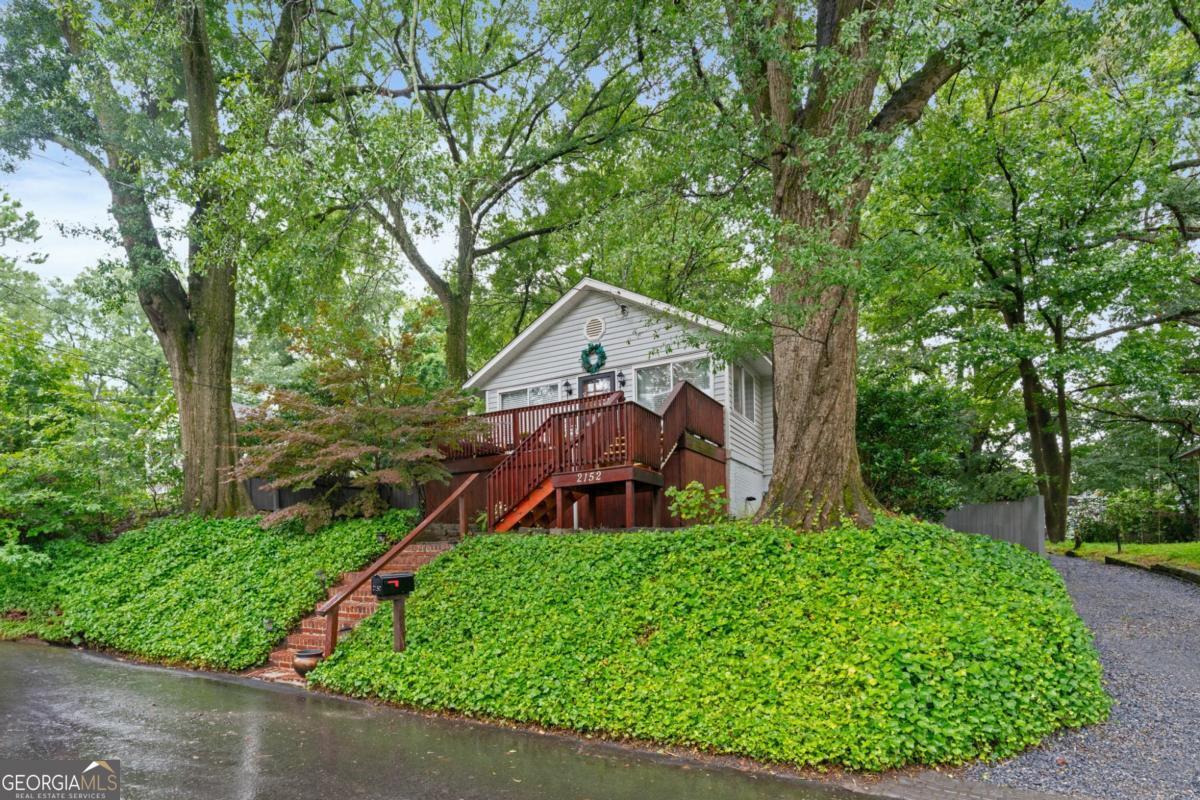 Charming single family home in the heart of Atlanta's highly sought after Riverside Community. Welcome to 2152 Forrest Place! Tucked away on a quiet, tree-lined street, this home is a hidden gem blending classic charm with modern comfort. Step inside to discover a bright, open living space featuring a 2 bedroom, 2 bath, ranch style plan. The family room is adorned with a beautiful brick fireplace that is the perfect focal piece. The kitchen is a perfect mix of function and style with stainless steel appliances, kitchen island, and ample cabinet space--ideal for both everyday meals and entertaining. The primary suite offers a peaceful retreat with a walk-in closet and updated ensuite bath. The additional bedroom and bath provides flexible space for guests or a home office. Outside, enjoy your screened-in back porch, private fenced-in backyard with a pergola, storage building, and a fire pit area perfect for relaxing in the evenings. Located in the quaint Riverside Community, you're minutes from top-rated restaurants, breweries, pubs, shopping, and parks. Easy interstate access, and just a short drive to Midtown, Downtown, and Buckhead. Whether you're a first-time buyer or looking to downsize without compromise, this home is ready for you and your personal touch. Don't miss out on this great home!