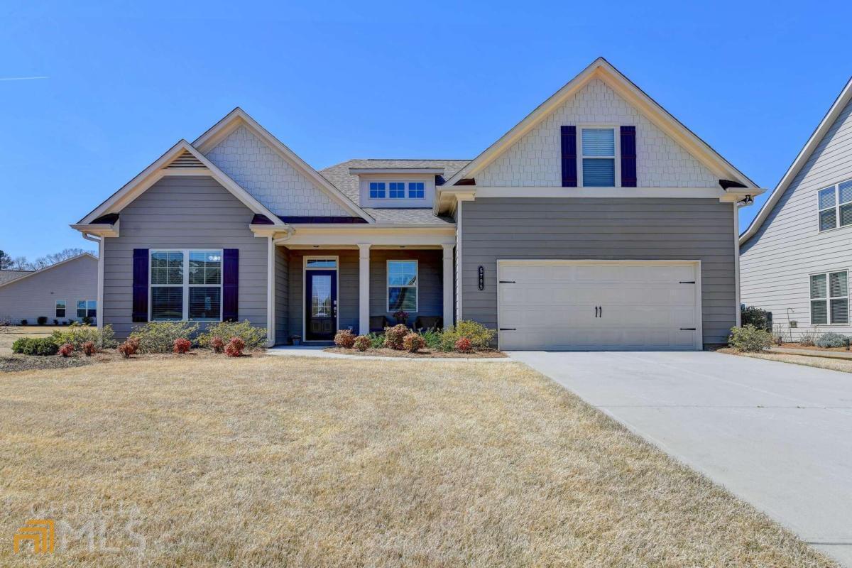 Hard to find 3 bedrooms on the Main and more upstairs?! Now you have found it! The Sinclair plan is the largest floorplan in this beautiful neighborhood! Over $72K in Builder Upgrades and Home Improvements! In addition to the 4 bdrms 3.5 baths, this home features a huge loft and bonus room. Large level premium lot with beautiful views and located next to a large green space. Kitchen features Quartz countertops, large island , 42 inch white cabinets, double oven and walk-in pantry open to the large vaulted family room with stone fireplace. Gorgeous main floor hardwood flooring. Master suite with tray ceiling and luxury spa retreat featuring a double vanity and huge semi-frameless tile shower with double shower heads and seat. Relax on the oversized back covered porch featuring two ceiling fans, grill and designer resurfaced patio. Professionally resurfaced garage floor and much more! Walk to pool and clubhouse. Low Forsyth county taxes. Grounds maintenance included in HOA fee.