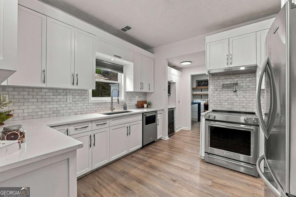 Photo of 3400 Duncan Bridge Drive, Buford, GA 30519 (MLS # 10866445)