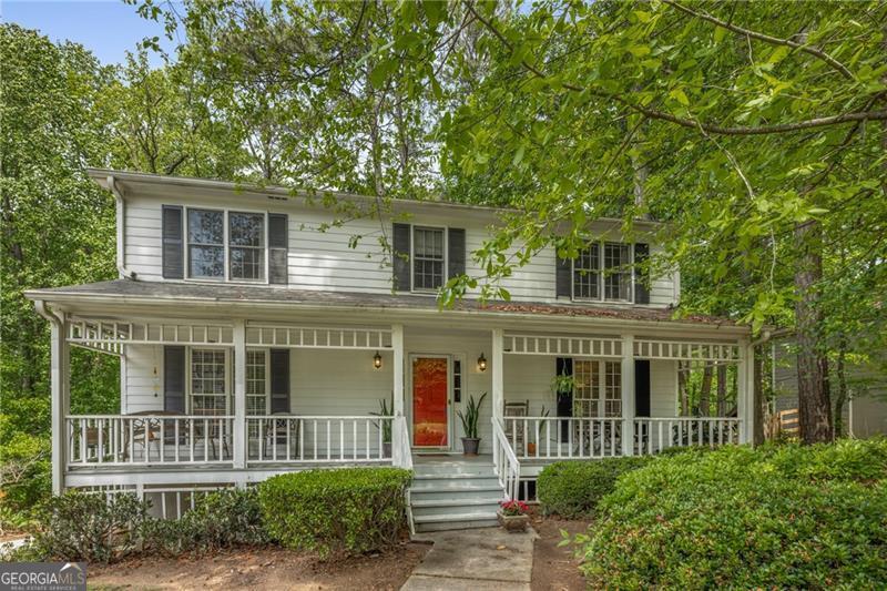 Lovely home located in the heart of East Cobb has it all featuring a rocking chair front porch. Open foyer leads to formal dining, living and family rooms. Family room features wainscoting, warm brick fireplace and access to the rear deck. Spacious kitchen with updated butcher block counters, stainless steel appliances and updated electric cooktop. Separate laundry room and door to rear deck. Upstairs features 4 bedrooms with 2 full baths. Master bedroom with walk in closet. Two car side entry garage with partial unfinished basement with loads of storage. Home is located within walking distance to the community amenities. Brookcliff features an active HOA, pool, tennis, playground and acres of greenspace with creek, trails and more. Top 10 East Cobb schools and easy access to shopping. Several million dollar plus homes in the neighborhood. Up to $26,250 in Down Payment assistance available to qualified Homebuyers through Preferred Lender