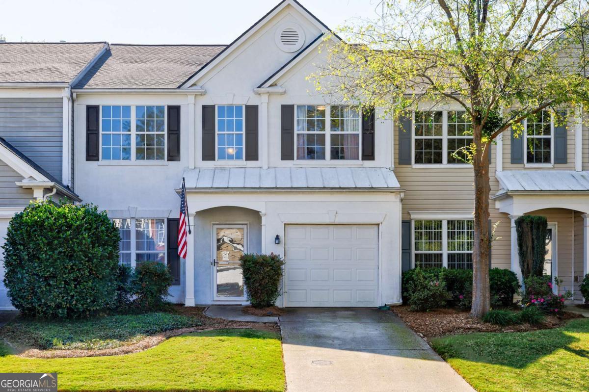 Welcome to 3703 Timbercreek Circle, a beautifully updated townhome located in the sought-after Creekside at Mansell community in Roswell, Georgia. This inviting two-story residence offers the perfect blend of style, comfort, and convenience. Step inside to discover a bright and open floor plan, where natural light fills the main living areas. The formal living room flows effortlessly into a modern dining space and a beautifully renovated kitchen featuring stainless steel appliances, updated cabinetry, and sleek countertops, ideal for everyday living and entertaining. A second living space with a cozy gas fireplace provides the perfect spot to relax or host friends and family. Upstairs, the spacious owner's suite feels like a private retreat, boasting a large walk-in closet and a fully renovated en suite bathroom with contemporary finishes. Two additional bedrooms share an updated full bath, offering ample space for family, guests, or a home office. Outside, enjoy a private fenced in patio, perfect for morning coffee, grilling on weekends, or letting pets play. The community also offers access to a swimming pool and well-maintained green spaces, and the HOA covers water, sewer, lawn care, and exterior maintenance for added peace of mind. Centrally located, this home is just minutes from GA 400, downtown Roswell, Alpharetta, North Point Mall, and an array of shops, restaurants, and parks. This move-in ready home combines low-maintenance living with a prime location-don't miss your chance to make it yours.