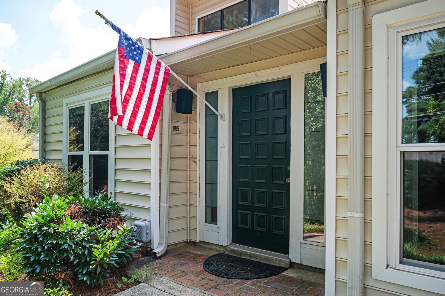 ONE LEVEL LIVING IN THE HEART OF EAST COBB! Welcome to charming 3 bedroom, 2 bath end-unit garden-level condo-a rare find in a peaceful, friendly swim/tennis community! Enjoy the ease of one-level living in the Villas at Parkaire that's tucked away, but yet close to everything you love about East Cobb. Step inside to a bright and spacious great room with vaulted ceilings, tons of natural light, and a gorgeous floor-to-ceiling stone fireplace that makes the space feel warm and welcoming. The eat-in kitchen features wood cabinets, tile floors, and newer stainless steel appliances including a top-of-the-line fridge that makes cooking a joy! The primary suite is your cozy retreat with its own vaulted ceiling, a large walk-in closet, and a private en-suite bath. Both bedrooms open out to a private, fenced patio perfect for morning coffee, grilling, or a little gardening fun. You'll love the two-car carport and plenty of guest parking just steps away. With swim and tennis amenities and friendly neighbors all around, this is the low-maintenance lifestyle you've been looking for. NEW HVAC SYSTEM. HOA covers exterior maintenance including roofs, water and sewer, trash pick up, termite bond, insurance on the building and 2 pools and tennis courts. Priced to sell and full of charm-come see it today before it's gone!