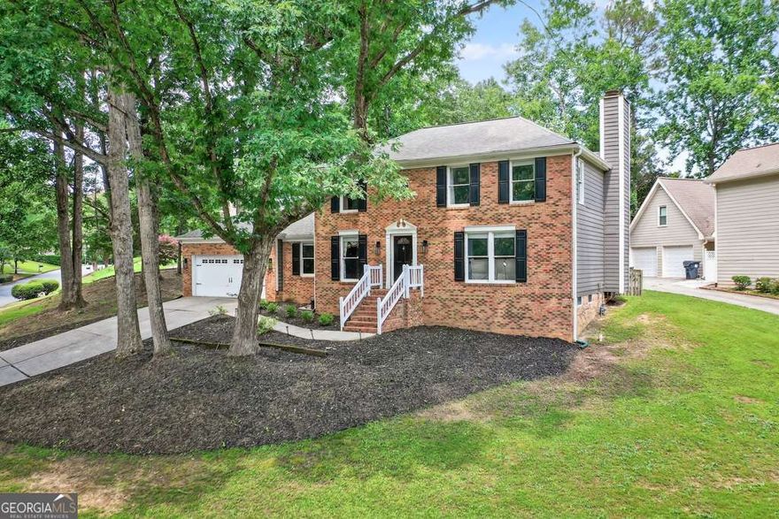 Incredible Value in Walton District - Finished Basement, Home Office & Upgrades!  Don't miss this rare opportunity to own a move-in ready home in one of East Cobb's most desirable neighborhoods-Villa Chase, zoned for top-rated Walton High School. Offering space, style, and smart updates, this home checks every box.  The renovated kitchen features on-trend grey cabinetry with gold hardware, granite countertops, stainless steel appliances, and a breakfast area-all open to a cozy fireside family room. A formal dining room, separate living room, private home office, and spacious laundry room add to the home's functionality and appeal.  Upstairs, the light-filled primary suite includes a spa-like bath with soaking tub, double vanities, and walk-in closet. Three secondary bedrooms share a full hall bath. The finished basement is a standout bonus-ideal for a media room, gym, or playroom, plus ample storage space.  Enjoy a level, fenced backyard with a freshly stained deck-perfect for outdoor entertaining. Recent upgrades include new main-level flooring, updated lighting, and a new fence. Priced competitively with features typically found in much higher-end homes-this home offers exceptional value in the heart of East Cobb.