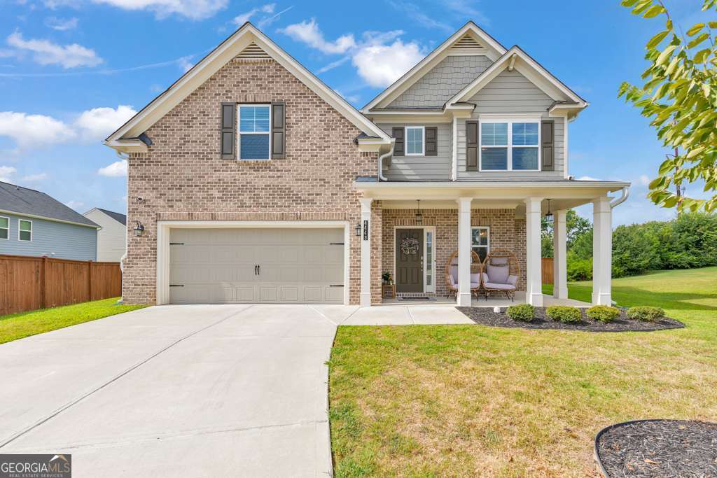 Welcome home to this beautiful 4 bedroom, 2.5 bathroom residence in the desirable Old Lost Mountain Estates community in Powder Springs! A charming covered front porch invites you in, where the foyer opens to a separate dining room, perfect for entertaining. The fireside family room flows seamlessly into a modern kitchen featuring white cabinetry, granite countertops, stainless steel appliances, a center island with seating, and a spacious pantry. A convenient half bath rounds out the main level. Upstairs, the oversized primary suite boasts tray ceilings, a luxurious ensuite bathroom with double vanities, a soaking tub, a separate shower, and a walk-in closet with built-ins. Three generously sized secondary bedrooms share a well-appointed full bathroom. Enjoy the outdoors from the rear patio overlooking the large, fenced-in backyard-ideal for relaxing or play. Additional features include an attached 2-car garage and a prime location in the McEachern High School district, with easy access to major highways, Marietta Square, and an abundance of shopping and dining nearby. Don't miss the opportunity to call this one yours!