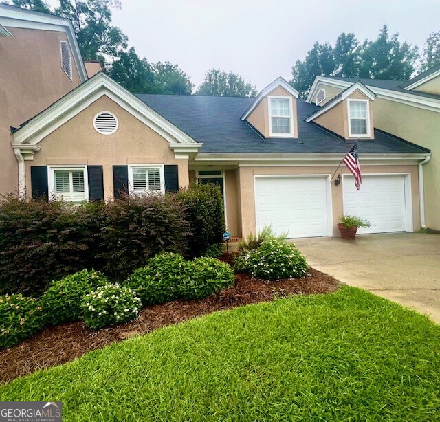 Charming and move-in ready one-level townhome in a desirable Macon location! This 2BR/2BA home features fresh interior paint, a spacious 2 car garage, and a covered porch overlooking a private backyard setting. The updated kitchen has new quartz countertops, marble backsplash and stainless appliances. Tons of storage too! Beautiful palladium window overlooking private backyard. Crown molding throughout. The layout offers easy living. Ideal for buyers wanting to downsize or just simplify, with close proximity to shopping, dining and healthcare. Don't miss this opportunity to own a well-maintained home that's ready for immediate occupancy!