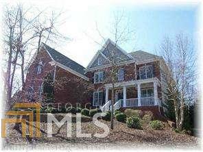 Expanded Oxford floorplan from Peachtree Res.in Rivermist. Future owners will love this spacious home and spend hours on the screened in porch or the level, fenced and private backyard. Huge kitchen w keeping room, walk in pantry & casual dining area open to the 2 story family room w bowed wall of windows! Heart pine floors on main level, 3 car garage, .68 acre lot and so much more. A master suite closet that Imelda would love and private retreat. Finished terrace level with media, game room, tile floors, kitchenette, bdrm/full bath, craft room & exercise/flex space. Top rated schools nearby.