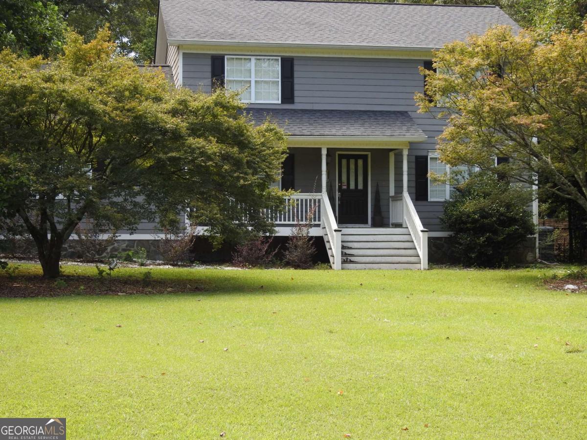 This home is on a Huge older Gwinnett county lot in sought after North Gwinnett Estates, over 1.5 acre level lot. No HOA just for grounds upkeep. This large home has 5 rooms on the main floor which one includes a sliding barn door and 4 on the second floor with an additional large building in the back yard with another 1-2 rooms and a single garage in additon to the 2 car garage attached to the house for a total of 10 rooms and 3 garages. Large level rear yard is separated into 3 different areas by large established trees (able to support 3 events at one time), landscape and flowers creating private areas. Inground heated Pebbletech Pool, works and is currently running just needs cleaning, waterfall into the pool needs a part and it will work. Double wrought iron gate for easy vehicle, boat even RV access to the rear yard. Minor cosmetics repair, owner is unable to at this time due to health. Home has solar panels on the back of the house, sun room/large dining area, exterior stone walkways, pebble granite saltwater pool, walking paths through the landscaped flower gardens, This home is close to shopping, malls, Lake Lanier, several parks, golf courses, airport and I-85, 30 min NE of Atlanta. Seller is selling due to a reduced income and health concerns. Swingset and side deck that is not covered is not safe, please use caution. This side deck area used to support a hot tub that was removed by the prior owner and not covered well, only a temporary fix. A hot tub could go back in this area. Altough price is pretty firm let's talk..