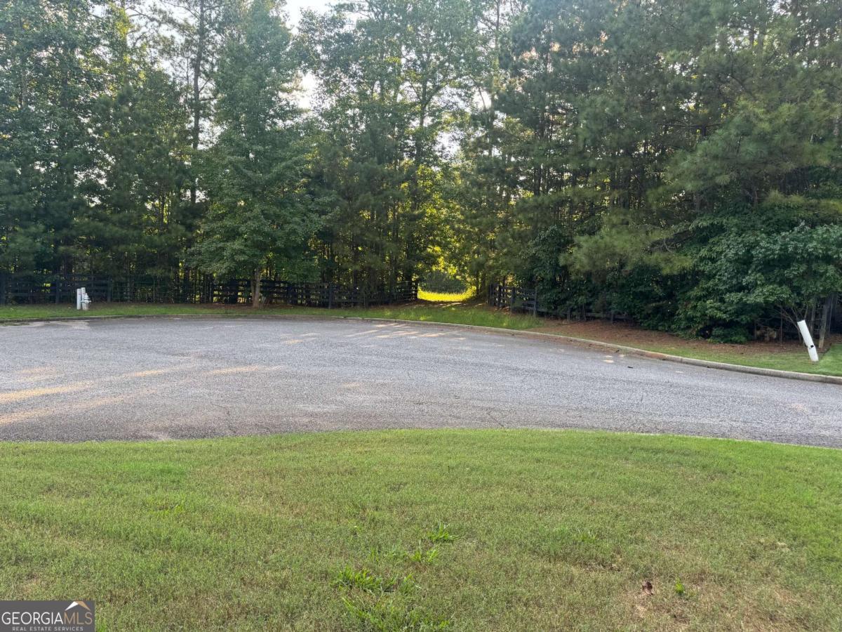 Luxury Custom Home Lot - Incredible opportunity to build your luxury dream home on 2+ acres or 6.52 acres (121, 124, & 126 Aaronwood Ct) in one of Alpharetta's most desirable and private cul-de-sac locations. Nestled among mature hardwoods and natural landscape, this gently rolling lot offers the perfect canvas for a high-end custom estate with endless possibilities-whether you envision a sprawling modern farmhouse, a timeless Southern retreat, or a transitional masterpiece with resort-style outdoor living. With no HOA, you'll enjoy full creative freedom to bring your architectural vision to life-add a pool, outdoor kitchen, guest house, or design for multigenerational living. The lot provides space, privacy, and flexibility rarely found in such a prime location. Conveniently located just minutes from Downtown Alpharetta, Milton, Avalon, top-rated schools, and GA-400, this exceptional property blends the serenity of estate living with unmatched access to dining, shopping, and major commuter routes. Don't miss this rare opportunity to own and build in North Fulton County. Whether you're a buyer looking to create a forever home or a builder seeking a prime homesite, Aaron Wood Ct is ready to bring your vision to life. Total land frontage for the land totals 164 Feet or lot average is . The parcels can be sold individually or as an assemblage of 6.52 acres. The property is in a subdivision where the last home sold for over $900K on a lot of 2.14 acres. Each lot has a different parcel number and legal description. Lot 6: 2.23 Acres 02N12 100; Lot 7: 2.15 Acres 02N12 101; Lot 8: 2.14 Acres 02N12 102