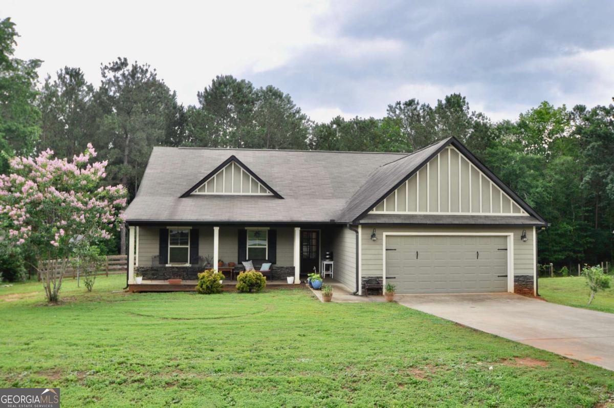 This adorable 3-bedroom, 2-bath home in Madison, GA offers a great open floor plan with plenty of space to relax and entertain. The living area flows nicely into the kitchen and dining space, and features a cozy fireplace, updated floors, and lots of natural light. The kitchen has granite countertops, a large island with seating, and tons of cabinet space. Sitting on a large, level lot with a fully fenced backyard, theres plenty of room to enjoy the outdoors whether its gardening, playing, or just relaxing. Located just minutes from downtown Madison and an easy drive to Athens, this home offers the best of both small-town charm and convenience.