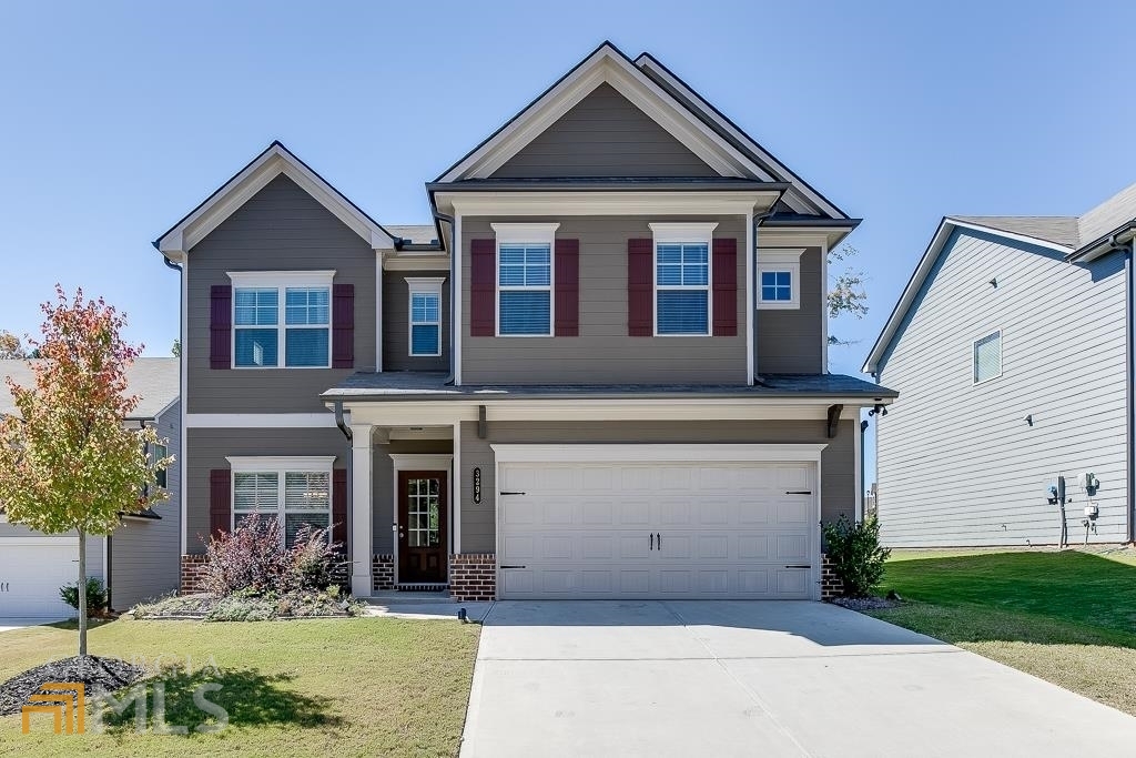 PRICE IMPROVEMENT!! Amazing location for a beautiful home! This 4 bedroom & 2.5 bath newly built home in Creekside at Mulberry Park has everything you are looking for including many builder upgrades! Open concept living allows for perfect hosting & entertaining flow. Elegant coffered ceilings & fireplace in living room. Oversized windows allow lots of natural light and view to the back yard with wooded privacy. Enjoy morning coffee on your covered patio with a privacy wall. The oversized kitchen island, stainless steel appliances, walk-in pantry, spacious eat-in area round out this fabulous kitchen. 1/2 bath on main level for convenience to guests. Hang your bags & coats in the convenient mudroom off of the garage. Second level features an expansive primary bedroom w/ luxurious en-suite bath including high ceilings, upgraded tile and a 7' shower! Large walk-in closet offers ample room for clothes, shoes & storage. This level also includes three more bedrooms w/ walk-in closets, spacious full bath & laundry room. Home is located in cul-de-sac and in close proximity to the community pool. Enjoy a nature walk through the trails in the neighborhood along Mulberry River or have a picnic in the greenspace! Home is conveniently located near Northeast GA Medical Center, Chateau Elan, grocery stores, restaurants, shopping, access to I-85 & so much more!