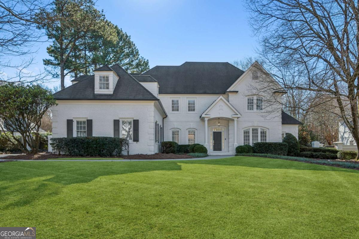 Welcome to this meticulously renovated 5-bedroom, 4.5-bathroom home, nestled in the heart of coveted Sandy Springs. This exceptional residence seamlessly blends modern luxury with timeless charm, offering expansive living spaces, high-end finishes, and thoughtful design at every turn. As you enter, youCOll be greeted by the elegant wood-paneled study, an inviting and sophisticated space perfect for work, quiet reading, or a home library. This classic feature adds warmth and character to the home, creating a retreat where productivity and relaxation can flourish. The heart of the home is the chefCOs kitchen, equipped with top-of-the-line appliances, sleek cabinetry, and a large islandCoideal for meal prep, casual dining, or entertaining guests. The open-concept design flows effortlessly into the sun-filled living and dining areas, offering the perfect setting for both family gatherings and intimate dinner parties. This home boasts two luxurious owners suitesCoone conveniently located on the main level, and another upstairs for privacy and retreat. Both owner suites feature custom walk-in closets and spa-inspired bathrooms with stunning vanities, soaking tubs, and oversized showers. A standout feature of this home is the 3rd floor flex room, offering endless possibilities for use as a media room, game room, home gym, or additional bedroom. The flexible space provides an ideal solution for any lifestyle, whether you need a private entertainment area or extra guest accommodations. Additional highlights include generously sized secondary bedrooms, each with ample closet space, and beautifully updated bathrooms. The open layout ensures seamless flow, making it perfect for hosting guests or enjoying everyday living in comfort. Step outside to your private oasis, featuring a sparkling gunite pool surrounded by lush landscaping and a spacious patioCoperfect for al fresco dining, entertaining, or simply unwinding in your own serene backyard. Located in one of Sandy Springs' most desirable areas, this home offers close proximity to top-rated schools, shopping, dining, and major highways. With its luxurious features, spacious layout, and unique spaces like the wood-paneled study and 3rd floor flex room, this home combines style, functionality, and comfort like no other. Don't miss the chance to make this stunning property your forever home! Brand new cooktop and microwave/oven to be installed soon.