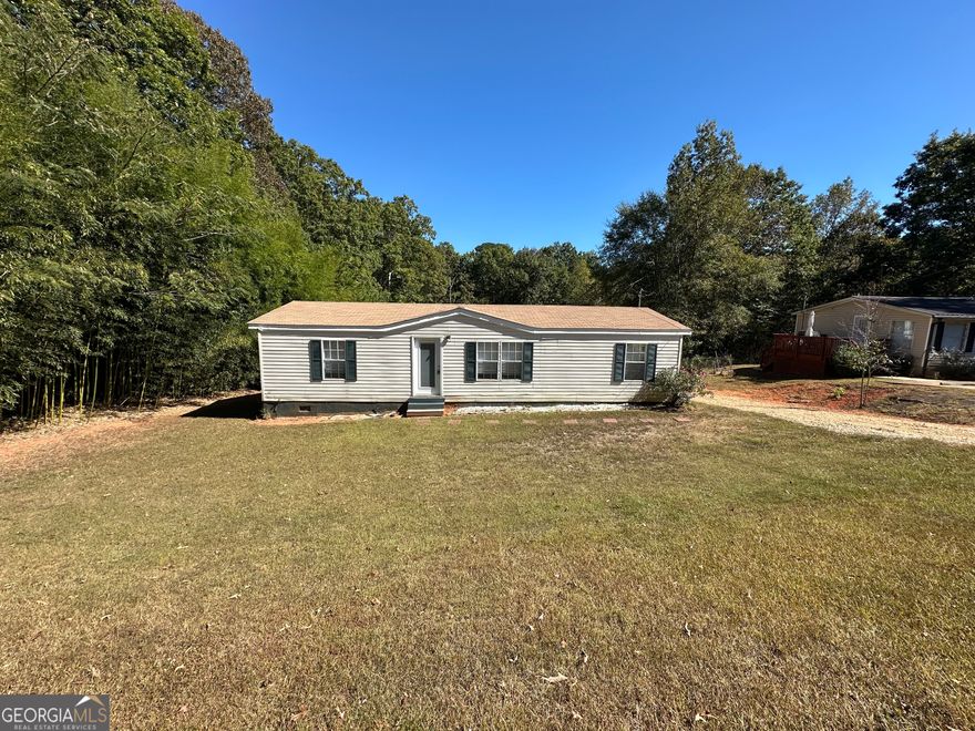 Great starter home or investment property. 3 bedrooms, 2 baths on almost 1 acre (.88). This home features an updated kitchen with granite countertops & tile floor, owner's suite bath has an updated double vanity with granite countertop, tile floor, separate shower & soaking tub, spacious owner's bedroom with large walk-in closet, kitchen is open to the family room and features a vaulted ceiling, split bedroom plan for privacy, (fridge, washer & dryer included), roof is approx. 5 years old and private back yard with storage building. Centrally located to Covington, Conyers & McDonough. Contact your Realtor to schedule your private showing.