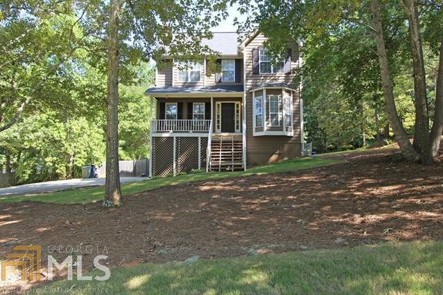 Welcome Home to this Immaculate Cape Cod Home!! Front Rocking Chair Porch Welcomes You! Family Room is Open to Large Kitchen with Built-In Breakfast Table. Large Separate Dining Room. Back Deck with Huge Level Yard Perfect for Entertaining! Upstairs features Huge Master Bedroom with Private Sitting Area, Master Bath with Garden Tub and Double Vanities. Drive Under Garage with Lots of Storage or Area for Workshop. Move In Ready! Convenient to 278 and new Paulding Wellstar Hospital Complex, Shopping Restaurants, and Paulding County Govt Center. Home Won't Last!!
