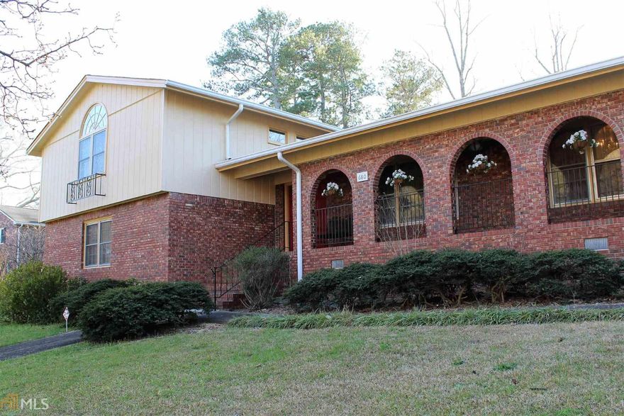 Brick Tri Level in established subdivision. This beautiful, custom built home features lovely foyer entrance, formal living room/dining room, kitchen with breakfast area, large laundry room and cozy great room with masonry fireplace. Sliding glass doors lead from great room to wonderful patio where you can enjoy the many beautiful flowers this spring. Lower level features office area, full bathroom and bonus room. Upstairs you will find a huge master with two walk in closets. Master bathroom with his and her vanities. Secondary bedrooms and full bathrooms are upstairs as well. Exterior features include nice workshop and fenced back yard. Extra storage is provided in the two car garage.