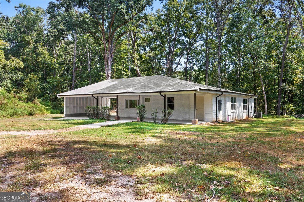 Visit this home on Saturday, September 20th, 12 pm - 2 pm! Move-in ready & beautifully reimagined, this 3 bed/2 bath ranch on 0.47 acres of level land has a new roof, plumbing, electrical, flooring, and more offering peace of mind at an incredible value. Enjoy a modern eat-in kitchen with granite countertops, large pantry, and island with lots of storage! Luxuriate in bathrooms that feature tile baths, stylish vanities, and updated fixtures. Relax on the expansive front porch or entertain on the back patio overlooking a workshop with water & power. A newly built carport and outdoor storage room add convenience and functionality. Step into your new home and private oasis!