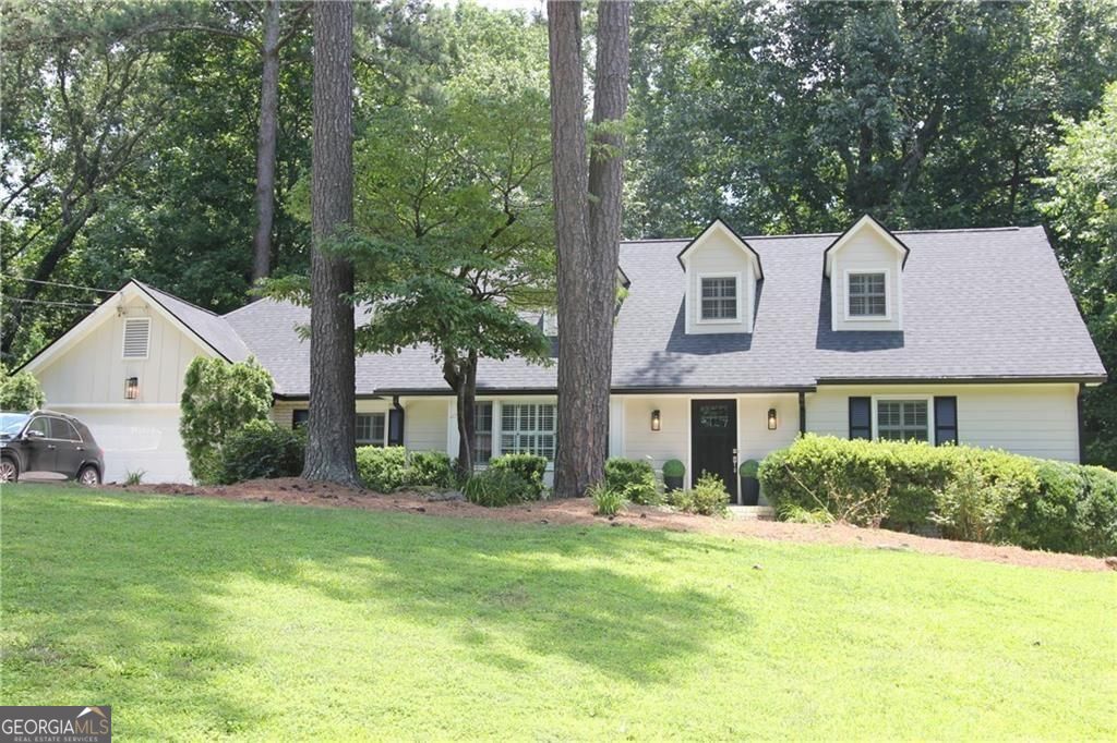 Total Renovation and Remodel! Charming Cape Cod in the heart of Sandy Springs with no HOA and a finished basement with a Gourmet Kitchen! This fully renovated 6-bedroom, 3-bath Home was designed with multi-generational living in mind. Inside, you will find two primary suites-one on the main floor and one upstairs-ideal for guests, in-laws. Everything has been completed for you. New Roof and Gutters, 2025 HVAC, fresh paint, two new kitchens and 3 new bathrooms - fully move in ready. Main Floor Highlights: three spacious bedrooms and one full baths Renovated chef's kitchen with new appliances and countertops, Family Room, Living room and large Deck. Upstairs are two bedrooms and one full bathroom. Basement Perks: Includes a private bedroom, full bath and a kitchen with its own entry-perfect for guests, an au pair, or rental income potential. Storage is abundant throughout the home and garage. New refinished White Oak Hardwood Floors and Plantation Shutters throughout. Speaking of the garage, you will love the new floor and the new EV charging station. This neighborhood offers Pool and Tennis Membership at Seville Chase and Princeton Square. Residents can join the swim team and the tennis activities. It has sidewalks and street lights. We have 2 lovely parks within a 1 1/2 miles, the Chattahoochee River Trails, and Lost Corner preserve for walking, jogging or just enjoying nature. We are close to the Sandy Springs city hall and performing arts center as well as many restaurants, shops and great grocery stores like Whole Foods and Trader Joe's. Highways I400 and I285 are easily accessible along with hospitals and the Marta North Springs station. Close to the new $99 million dollar renovated North Springs High School,