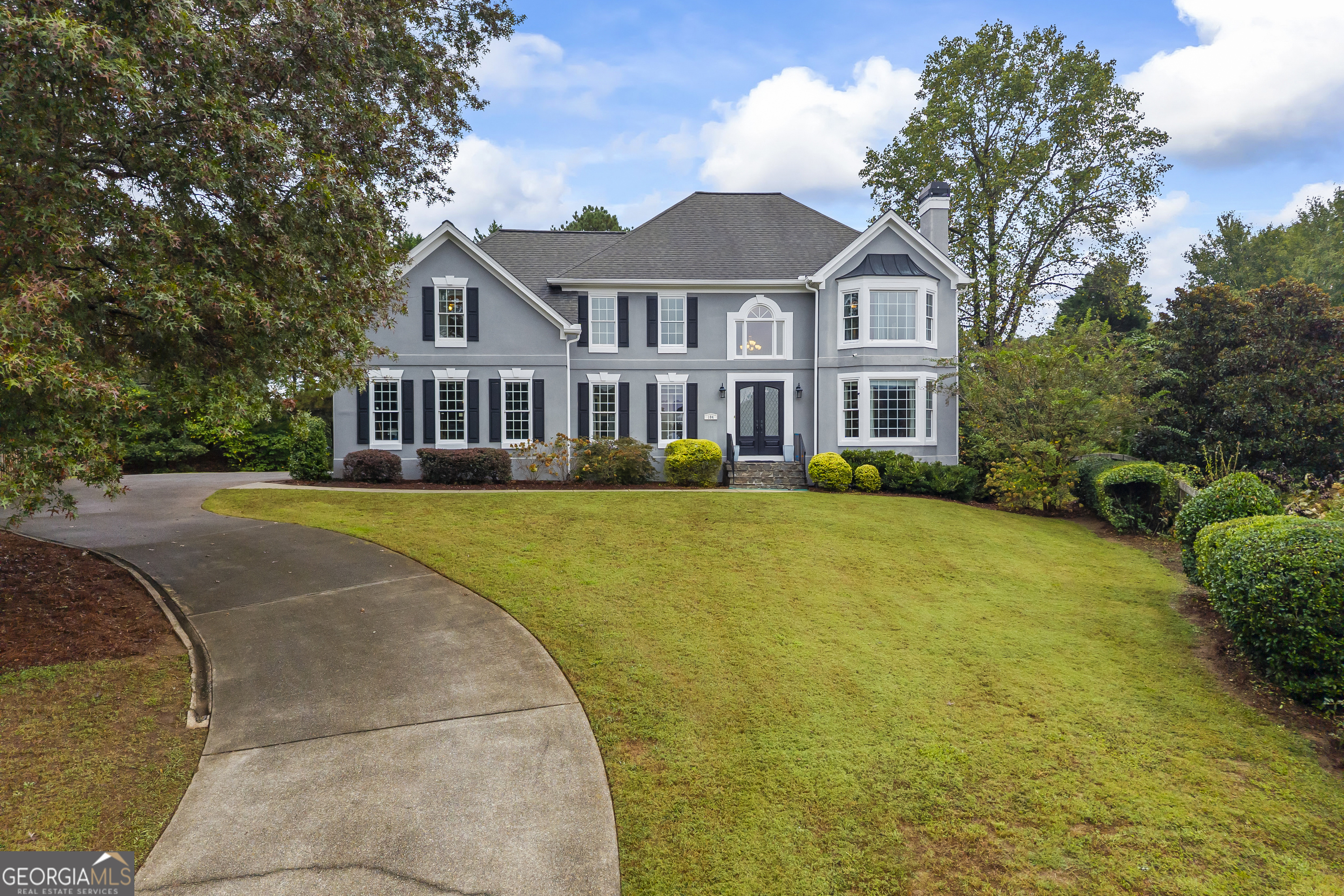 Stunning Stucco Home with Side-Entry Garage in Oak Leaf Subdivision, East Cobb This beautiful home sits gracefully at the top of a quiet cul-de-sac. The picturesque drive up reveals elegant glass double doors that set the tone for the home's sophistication. Step inside to a grand two-story foyer, where hardwood floors flow throughout the main level. The formal living and dining rooms open seamlessly to one another, creating the perfect setting for entertaining. The soaring two-story family room boasts a cozy fireplace framed by custom built-in bookshelves. The renovated chef's kitchen is a showstopper, featuring stainless steel appliances including double ovens, cooktop, dishwasher, and refrigerator. A spacious island with storage on both sides, bar seating, and a breakfast nook make this the heart of the home. With four spice racks, a pantry, and abundant cabinetry, storage is never an issue. Just off the family room, enjoy a relaxing sunroom and deck for effortless indoor/outdoor entertaining. The main level also includes a convenient half bath, laundry room, coat closet, and additional pantry. Upstairs, the primary suite is a retreat of its own, with a fireplace, renovated spa-inspired bathroom featuring a soaking tub and separate shower, and a large walk-in closet. A secondary bedroom with a private bath is perfect for guests, while two additional bedrooms share a Jack & Jill bathroom. The finished basement offers a full in-law suite, complete with its own kitchen (stove, refrigerator, dishwasher, sink, cabinetry), laundry room, living room, and multiple bedrooms including one with an en-suite bath. A flex room makes an ideal office, while double doors open to the patio and spacious, level backyard --perfect for gatherings. With its thoughtful updates, abundant storage, and versatile living spaces, this home truly lives like two homes in one. Located just minutes from shopping, dining, Truist Park, and major highways I-285 and I-75, this East Cobb gem is ready to welcome you home. Preferred Closing Attorney is Campbell and Brannon, 3405 Dallas Hwy, Marietta (678) 816-4098