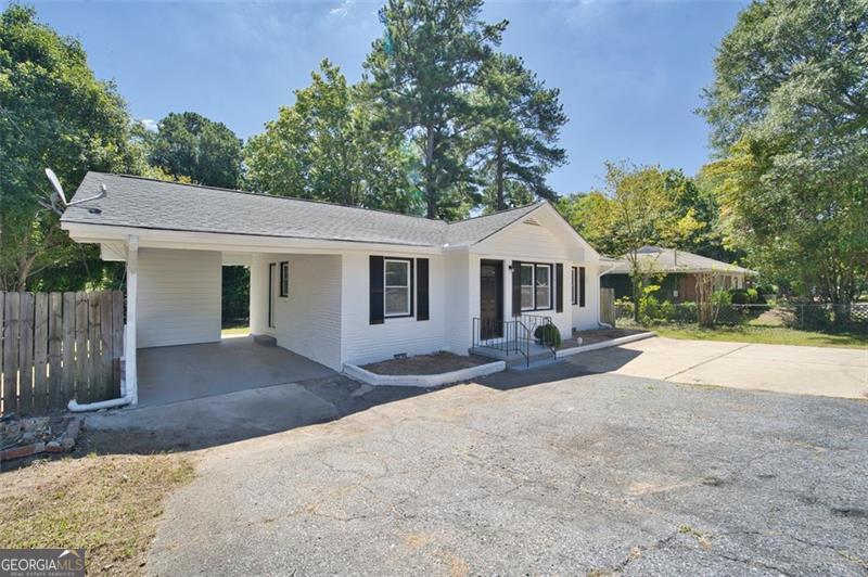 Beautifully renovated 3 bedrooms 2 full baths ranch. Move-in ready. Great for first time home buyers or investors. No HOA. Conveniently located near schools, shopping, park and restaurants. Nice & bright home. New interior and exterior paint. New interior and exterior doors, New kitchen with quartz counter, New appliances, New cabinets, New faucet and sink. New LVP flooring throughout. Spacious primary suite with new oversized bathroom with double vanity, quartz counter, modern tiled/glass shower and tiled floor. Upgraded and all new secondary bathroom. New light fixtures. Newer windows. An Attached carport and extra spaces for multiple cars in front. Beautiful large and private backyard to relax and enjoy the peace & quiet and/or entertain. Buy this great quality home with confidence!