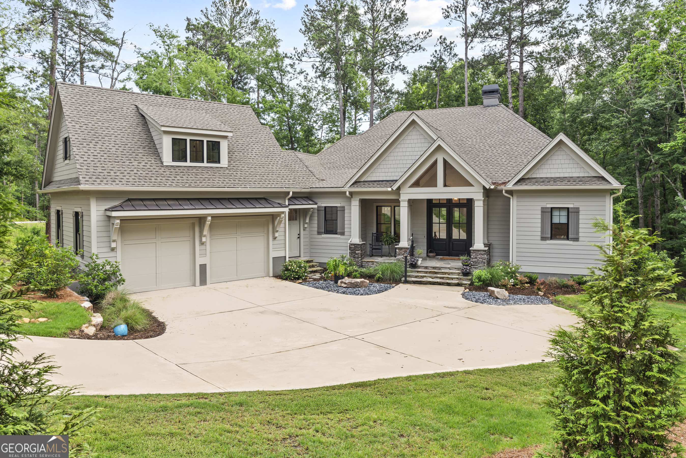 Welcome to your dream escape-where style, comfort, and a little touch of lake magic come together in this custom 5-bedroom, 4.5-bathroom stunner. Tucked into the scenic Richland Pointe community, this home isn't just beautiful-it feels right from the moment you step in. The main level is open, airy, and made for connection. The living room brings all the cozy charm with its striking beamed ceilings, expansive windows, and a fireplace that invites you to kick back and relax. With the open concept floor plan, the kitchen is only steps away and is a total showstopper with its sleek design, a big center island, stainless steel appliances, recessed lighting and more! Also on the main level is the laundry room and the primary suite that has coffered ceilings for that extra detail and an incredible en-suite bathroom. Making your way down to the terrace level you'll discover your new go-to spot for relaxing or entertaining-a spacious family room complete with a wet bar and three inviting guest bedrooms! Outside, you can choose from either the screened-in deck or the patio, but both offer a chance to soak in all the peaceful moments. If you need extra room, there's a stylish guest suite over the garage-perfect for giving visitors their own private hideaway. This home is the real deal, and you're just a short ride from Richland Pointe's newest gems: a sparkling marina, family and adult pools, a top-notch fitness center, spa, and a lakeside restaurant where the sunsets hit different. Seller is making a golf club membership available! Schedule a showing now, so you can make this home yours!