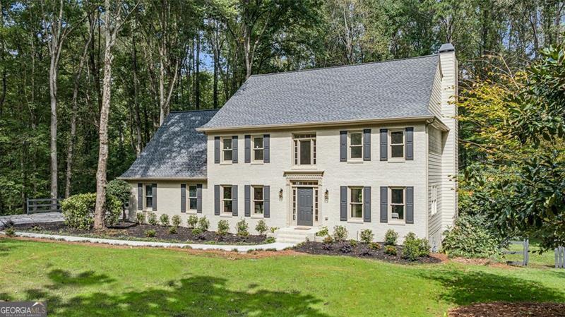 Welcome to this gracious and updated classic brick in the sought-after Jefferson Township community! From the dramatic two-story foyer to the shiplapped screened porch overlooking a lush, backyard - this home truly has it all. The upgraded eat-in kitchen features quartz countertops, crisp white cabinetry, sleek stainless steel appliances, and a charming pantry. The gleaming real oak hardwood floors flow throughout the main level, complemented by upgraded lighting, crown molding, and paneled details. The flexible floor plan is flooded with natural light and includes a formal dining room and easy transitions between living spaces, perfect for entertaining or relaxing at home. Step onto the screened porch to enjoy your morning coffee and the cool breeze, surrounded by shiplap finishes and pastoral views. The spacious deck extends your living area outdoors - ideal for gatherings or quiet evenings. Upstairs, the primary suite offers a peaceful retreat with a spa-like bath, while three additional bedrooms and a full bath complete the upper level. The terrace level includes another bedroom and bath, plus versatile flex space perfect for a home office, gym, or guest suite. The fenced backyard provides plenty of room for play - perfect for pets or outdoor activities. Jefferson Township offers a clubhouse, pool, tennis courts, and playground, all within minutes of Historic Downtown Marietta, Marietta Square, and Mabry Park. Convenient access to GA-400 and I-75 ensures an easy commute to shopping, dining, and entertainment. Local favorites such as Yeero Village, Lucia's Italian, Mika Sushi, RISE Coffee & Tea, and Publix are just minutes away. Enjoy quick access to Roswell, Alpharetta, and Avalon for even more retail and nightlife options.