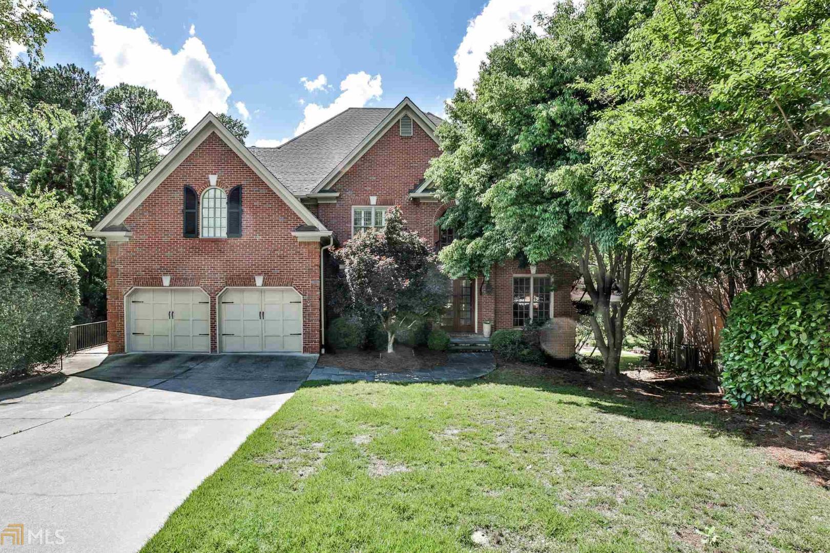 You've found the home that offers it all! Spacious and elegant, with tasteful updates throughout--formal living and dining rooms, large family room open to kitchen and breakfast room.  Light-filled family room overlooks large deck and screened porch perfect for outdoor parties. Hard-to-find guest suite on main level. Lower level boasts spaces for media room, game room and exercise room with a full bath--an ideal in-law suite, if desired. Second story with master suite and 4 generous-sized secondary bedrooms.  Large back yard, fully fenced and private!
