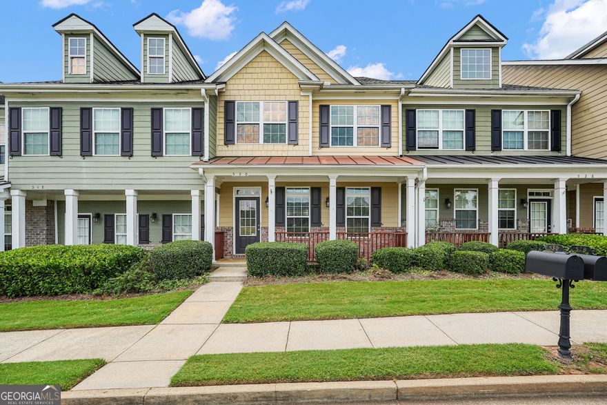 This beautifully renovated 2-story townhouse blends modern sophistication with timeless character in every detail. A welcoming rocking-chair front porch sets the tone, opening to an inviting interior highlighted by graceful arched doorways, detailed crown molding, upgraded designer lighting, and durable LVP flooring that flows seamlessly throughout the main level. At the heart of the home, the gourmet kitchen impresses with a stylish breakfast bar and a full suite of high-end stainless steel appliances that will remain with the property. Designed for effortless entertaining, the kitchen featuring new Calacatta quartz countertops, overlooks the spacious family room, creating a warm and open gathering space. The primary suite is a luxurious private retreat, complete with a tray ceiling and a covered balcony ideal for quiet mornings or evening relaxation. The recently renovated spa-inspired bath offers dual quartz vanities with chic gold-accent lighting, oversized 24"x12" ceramic tile flooring, and a frameless glass shower with designer subway tile and an elegant shower wand. A spacious walk-in closet enhances both function and style. Generously sized secondary bedrooms, along with thoughtful enhancements throughout, ensure comfort for family and guests alike. Ideally located just minutes from vibrant Downtown Woodstock, the Outlet Shoppes at Atlanta, and the Town Lake area, this move-in-ready residence also offers the advantage of being within some of the most sought-after school districts in Cherokee County.