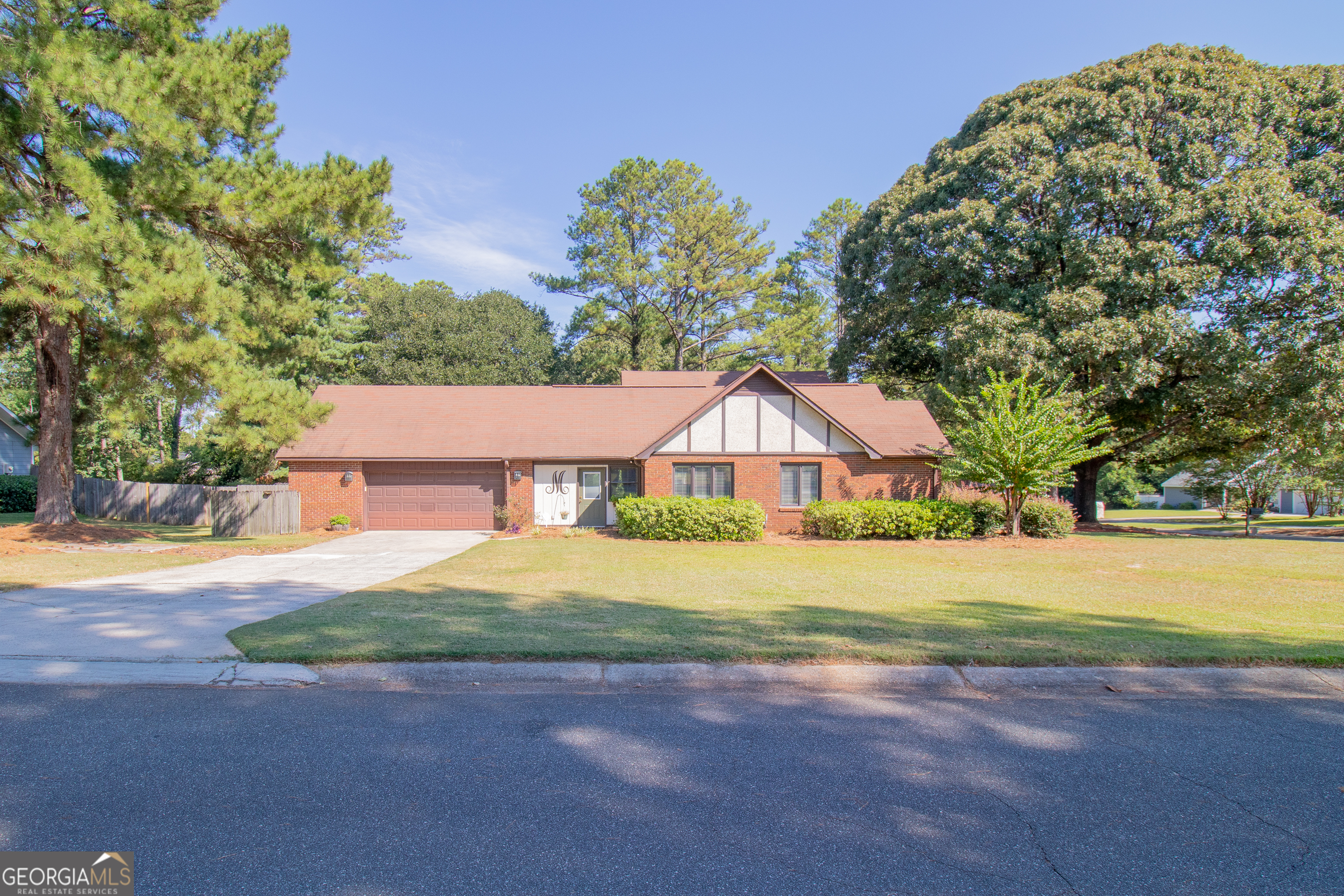 Welcome to this beautifully maintained four-bedroom, three-and-a-half-bathroom home spanning nearly 3,000 square feet, perfectly balancing comfort and style with room for everyone to spread out. Enter inside and you'll immediately notice the abundance of natural light flowing through every room, while high ceilings create an impressive sense of openness throughout. The thoughtfully designed layout features bonus rooms that give you flexibility to create exactly what you need-whether a home office, entertainment space, craft space, or cozy reading nook. The primary bedroom provides a peaceful retreat, while you enjoy the elegant spa-inspired primary bath featuring a sunken garden tub with tile surround, gold accents, chandelier lighting, and abundant built-in storage...perfect for relaxation and pampering. The three additional bedrooms offer comfortable accommodations for family or guests. With three full bathrooms plus a convenient half bath, morning routines run smoothly, even in busy households. One of the true highlights is the incredible outdoor space featuring a north facing large deck perfect for everything from quiet morning coffee to weekend barbecues. The organic soil garden beds are already established and waiting for your favorite plants, herbs, or vegetables. The generous lot size provides room to breathe, enjoy outdoor activities, and excellent privacy for weekend yard games or simply relaxing in the peaceful setting. Located in a desirable Warner Robins neighborhood, this home offers suburban tranquility with convenient access to excellent schools, shopping, dining, and recreational opportunities with close proximity to Robins Air Force Base making it particularly convenient for those seeking an easy commute while enjoying a peaceful residential setting. From the moment you enter through the front door, you'll feel the difference that comes from a truly cared-for home. The combination of spacious living areas, fantastic outdoor amenities, prime location, and turn-key condition makes this house a rare find that checks all the boxes. Give me a call to schedule your tour today!