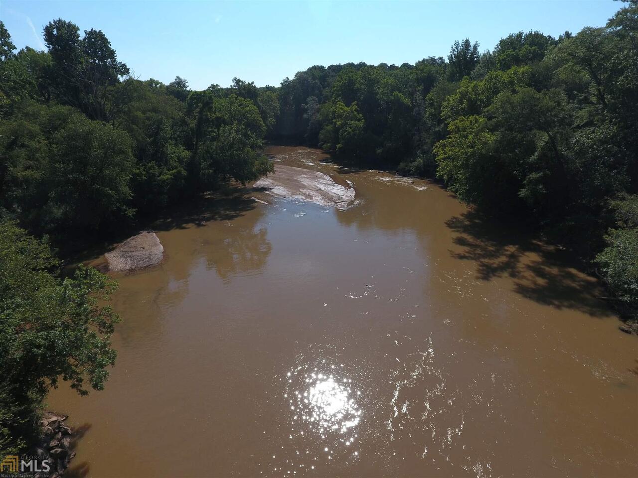 This investment grade property offers large acreage in the highly desirable Oconee County. Only 5 minutes from downtown Watkinsville and 15 minutes from downtown Athens, this property is ideally located between two growing areas. It is bounded on the north by just under a mile of frontage on the Oconee River as well as a creek. There is 4,323 feet of paved road frontage on Barnett Shoals Rd. Across the river is the Warnell School of Forestry and Natural Resources' Whitehall Forest.  The property is currently timbered and has pasture suitable for livestock, but has tremendous future potential.