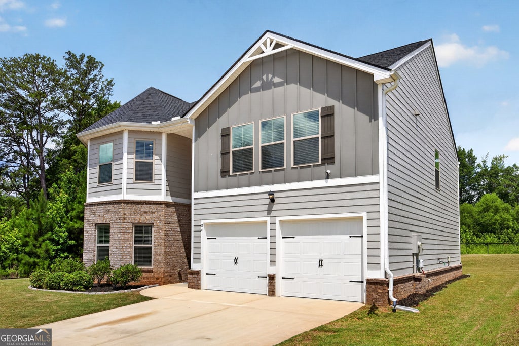Photo of 84 Sandy Creek Drive, Covington, GA 30014 (MLS # 10801540)