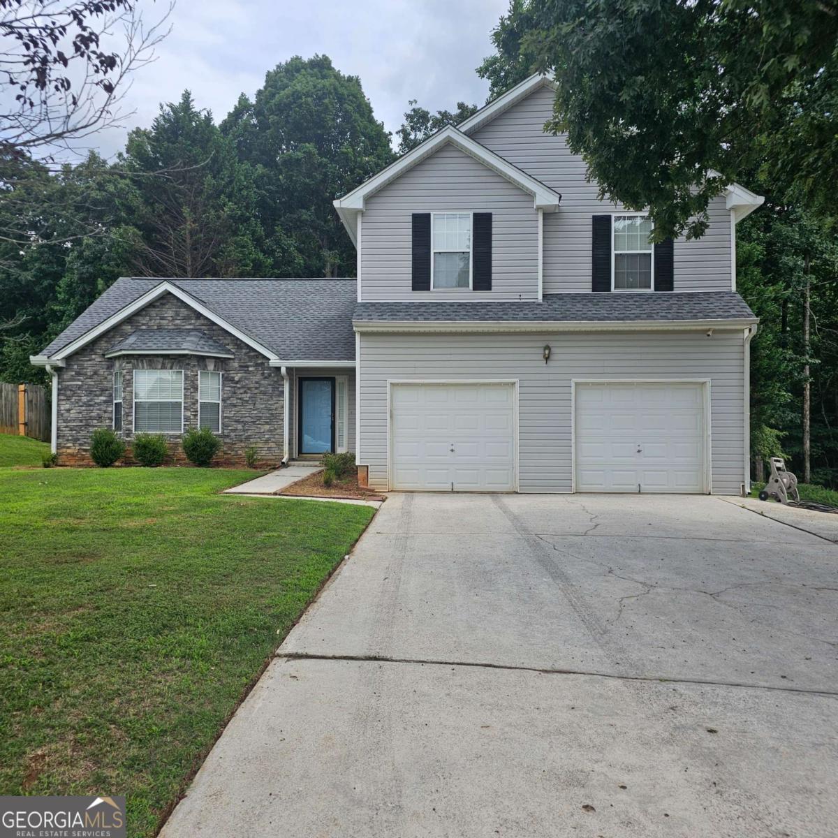 Enjoy this quiet community in the city of Fairburn 3 bedroom 2.5 baths perfect for family living. Separate living room, dining room and family room with a fireplace. Large open eat in kitchen overlooks the family room. Large size master suite with separate shower/tub and walk in closet spacious secondary bedrooms. Creekside High School and Bear Creek Middle School are both within walking distance. Home also has a large back yard and 2 car garage. Don't miss out on this nice rental property. Call Today!