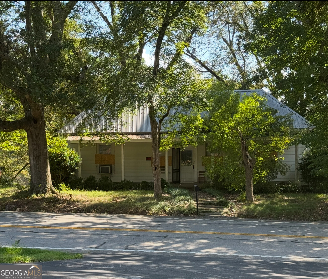 Step back in time with this 1915 home full of character and potential, situated on a spacious 1.827-acre lot. The house is a true fixer upper, ready for someone with vision to bring it back to life or create something new. With nearly 2 acres of land, there's plenty of room for gardening, outdoor living, or expansion. The location provides convenience to Jefferson, Commerce, and I-85 while still maintaining a quiet, country setting. Whether you're an investor, builder, or buyer looking for a historic home to restore, this property has endless possibilities. Home is being sold as-is with no disclosures. Owner is a licensed real estate broker.