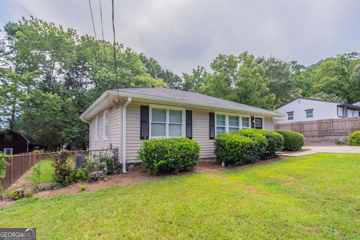 Welcome to this charming single-level ranch home nestled in the Casey Park community of Marietta. Featuring 2 spacious bedrooms and 1 full bathroom, this residence showcases updated flooring, fresh interior paint, and modern stainless steel appliances in a bright, functional kitchen. With its classic hardwoods, off-street parking, and a sizable backyard complemented by a wood deck-this home provides cozy comfort and room to personalize. Ideal for first-time buyers, downsizers, or investors seeking convenience near Windy Hill Road, major highways, and shopping centers.