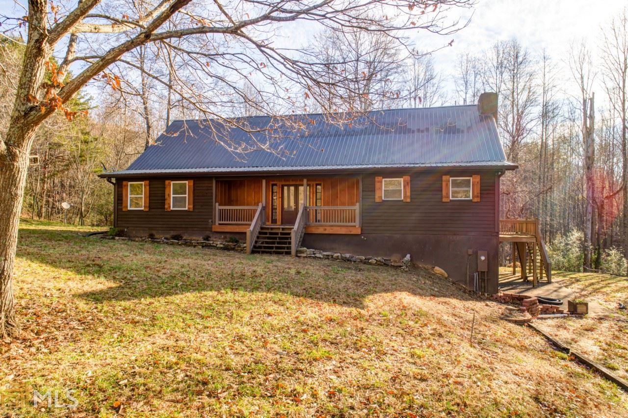 Heaven on Earth! If you like bucolic settings, driving by pastures full of animals and mountain views, this place is for you! Sunlight floods about every room in this home. Open the double front doors into a greatroom with a white kitcehn, granite counter tops and a family room with french door access to the decks, leading to mountain view. Every bedroom has its own FULL bath room. There is what I would call a barndomiuum. The building looks like a barn, but has 2 bedrms, a full kitchen