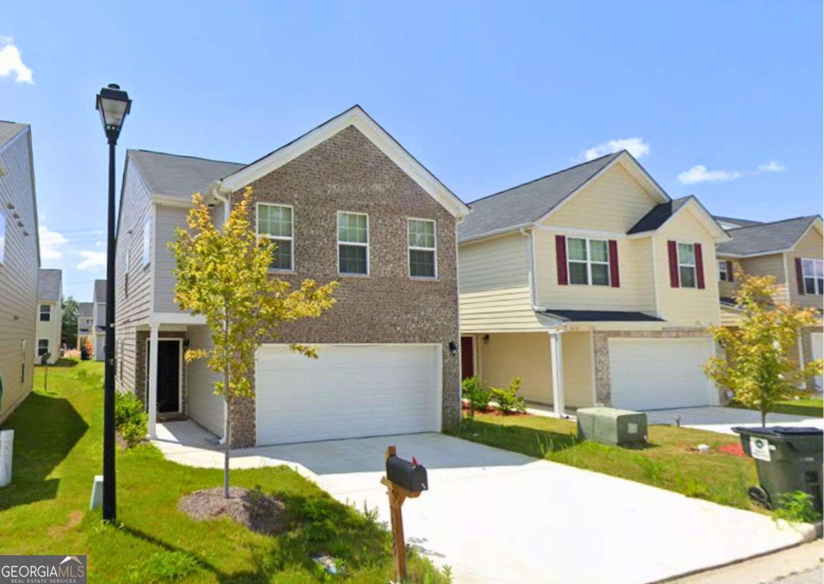 Charming home in a quiet, convenient location near highways and the Atlanta airport. Recently updated with fresh interior paint, new carpet, and flooring. The main level offers an open-concept kitchen and living area, pantry, and 2-car garage. Upstairs you'll find the primary suite with a double vanity, soaking tub, and separate shower, along with two additional bedrooms, a full bath, and laundry. Turn key + investor friendly!