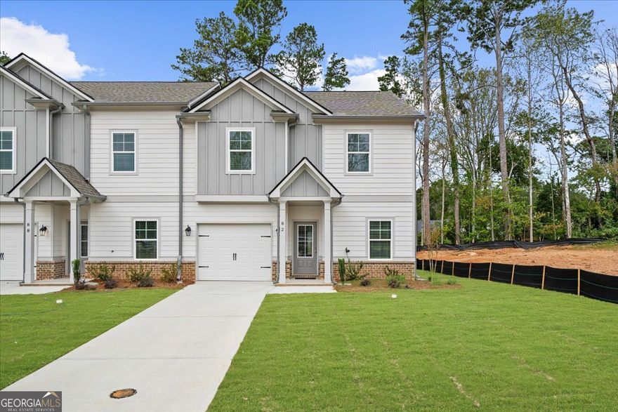 $10,000 BUYER INCENTIVE with preferred lender. New Construction townhomes in The Village at Maple Street in downtown Dawsonville - MOVE IN NOW! the Townsend plan built by EMC Homes GA offers first floor living with zero-step entries in a beautiful END UNIT on the cul de sac! This 3 bed/ 2.5 bath features PRIMARY ON MAIN with walk in shower and walk in closet, beautiful open kitchen with white cabinets, tile backsplash and upgraded countertops - large island with pendant lights overlooks family room. Enjoy your large backyard from your serene COVERED PORCH! Downstairs also includes lovely entrance foyer, OFFICE, half bath and 7" laminates in main living area! Upstairs are 2 large bedrooms that share a full bath and large, open bonus LOFT area! The Village at Maple Street offers open concept floor plans offering aging in place-friendly features like lawn care and exterior maintenance-all handled for you! This is low maintenance living at its best - with no age restrictions! The Village at Maple Street is conveniently located in downtown Dawsonville near the North Georgia mountains, parks, and just minutes from Rt 400 and the North Georgia Premium outlet mall, shopping, dining, mountain wineries and Lake Lanier! Homes are currently under construction with completion this summer. STOCK PHOTOS.