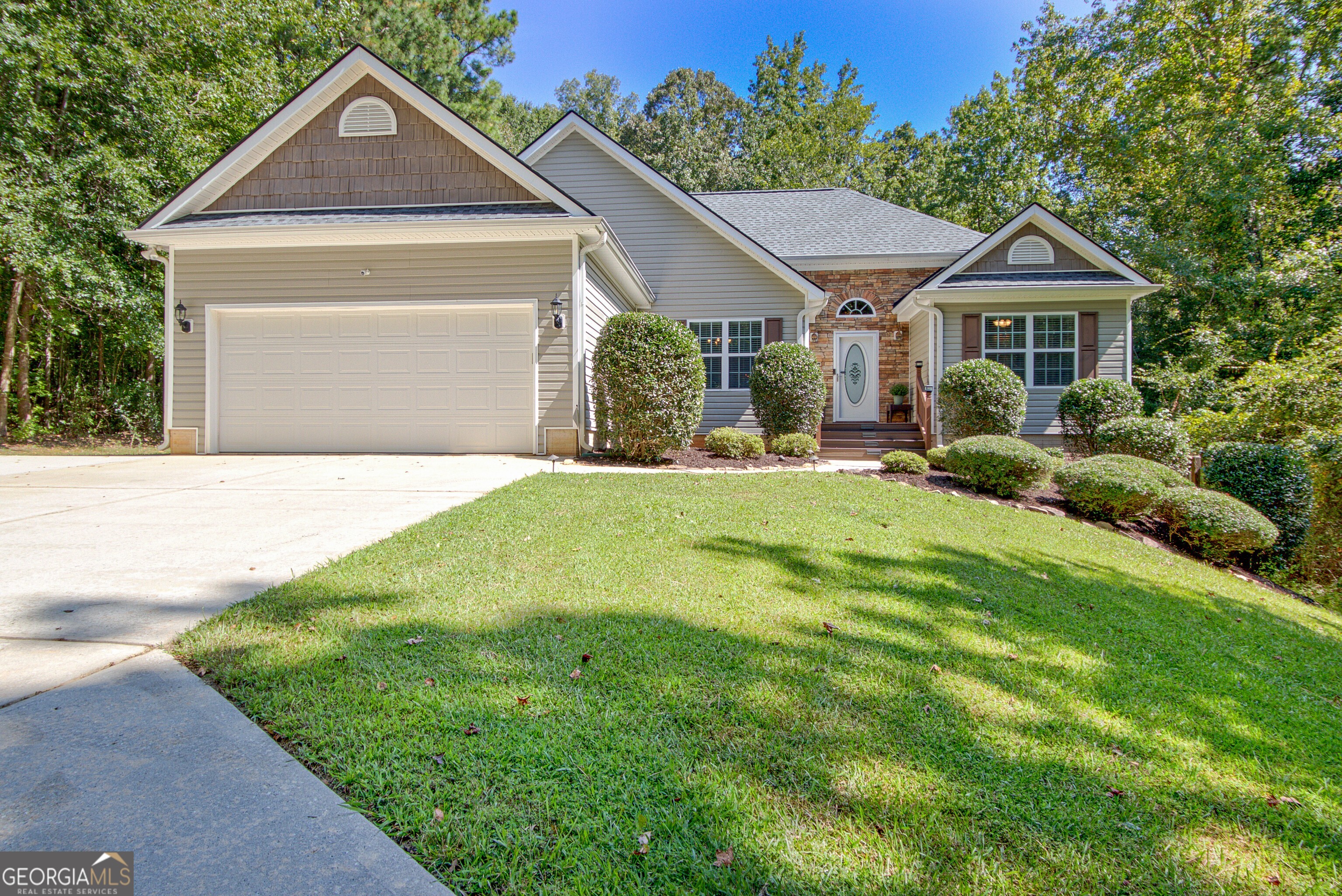 **Spacious Ranch with Finished Basement, Fireplaces & Modern Updates** Discover 3,336 sq ft of versatile living space in this beautifully maintained ranch home, offering 3 bedrooms and 2 baths on the main level plus a fully finished basement with 2 additional bedrooms, 1 full bath, and expansive entertaining areas. The main floor features a welcoming layout highlighted by custom built-in shelving in the dining room, updated lighting and ceiling fans, and a trey-ceiling primary suite with a soaking tub, separate shower, and walk-in closet. A cozy fireplace anchors the main living area, creating the perfect gathering space. Downstairs, the finished basement includes a full living and dining area, a stylish wet bar, storage space, and a spa-like bath with a walk-in tile shower and glass door. A second fireplace adds warmth and charm, making this level ideal for guests, in-laws, or multi-generational living. Outdoor living is equally impressive with a back deck featuring a metal roof and screened area built in 2019, an extended basement-level patio, a firepit area, and a 5' black chain-link fence with dual gates installed in 2023. A custom swing set also remains with the property. Major systems have been thoughtfully updated, including a new septic system in 2019, water heater in 2021, HVAC in July 2024, and a brand-new roof in March 2025. This move-in ready home combines modern upgrades, classic comfort, and abundant space for family and friends.