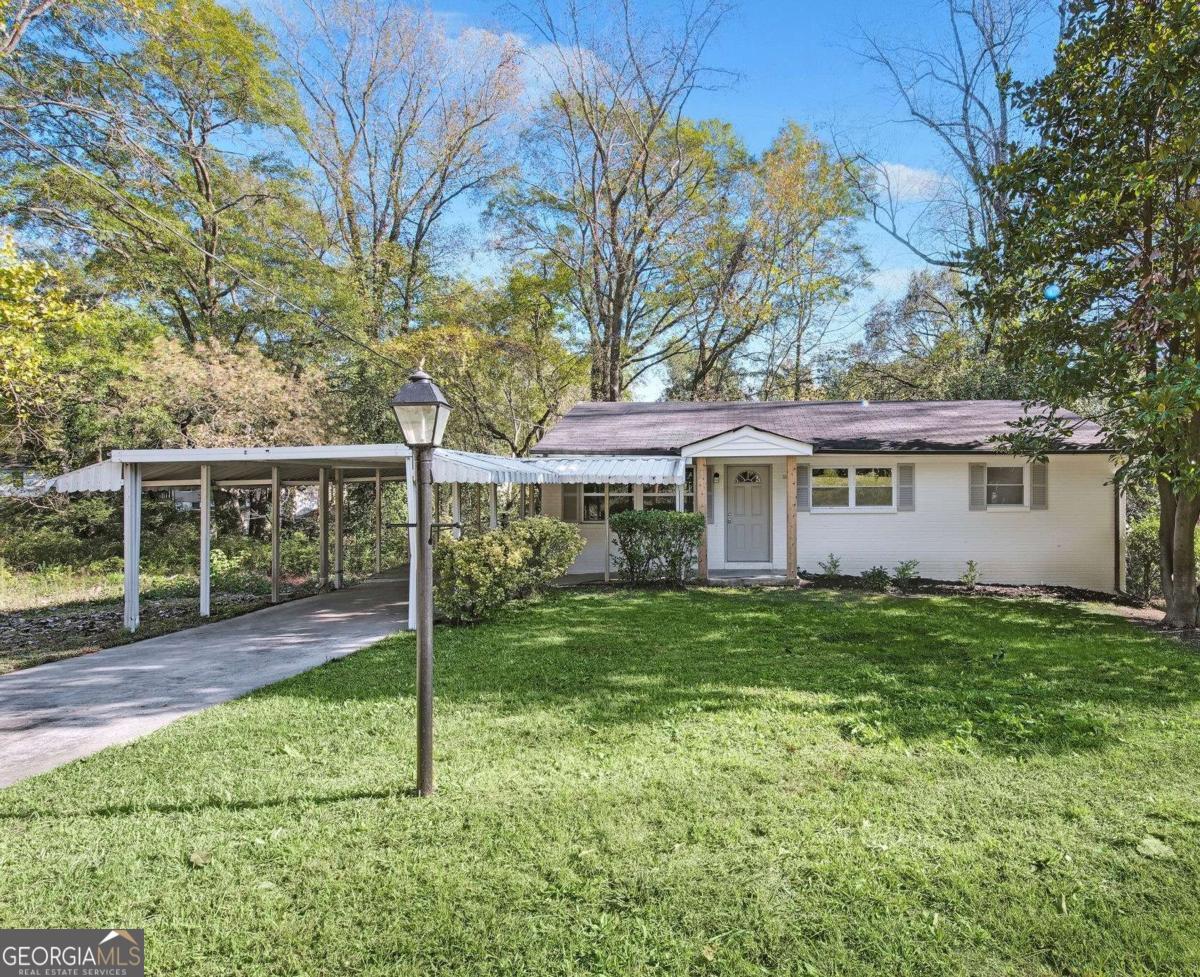 This beautiful fully renovated home features brand-new electrical, plumbing, windows, and stunning hardwood floors throughout, offering both charm and peace of mind. The expansive open-concept kitchen is perfect for entertaining, complete with a large island, coffee bar, granite countertops, stainless steel appliances, and recessed lighting. Step outside and enjoy the newly added large, fully fenced-in backyard-ideal for pets, play, gardening, or outdoor gatherings. Nestled on a quiet street filled with natural light, this home is just minutes from Westside Park, public transit, and downtown Atlanta. The spacious basement is ready for your vision giving opportunity to add another bathroom and two bedrooms.