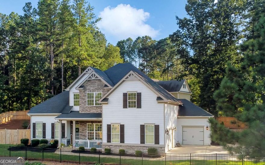 Welcome to 601 Legacy Run, a beautifully designed 4-bedroom, 3.5-bath Craftsman home nestled on a quiet cul-de-sac in the highly sought-after Creekside Estates community. Built in 2019 and offering 3,530 sq. ft. of elegant living space, this home perfectly blends classic charm with modern luxury.    Freshly painted on the main level, this move-in ready home greets you with an inviting open floor plan, 10-foot ceilings, and refined coffered and tray ceiling details. The gourmet kitchen is a chef's dream-featuring white cabinetry, a massive island with pot filler, double ovens, and stunning stone countertops-perfect for cooking and entertaining alike. The adjoining family room offers a cozy gas log fireplace and expansive windows overlooking the private, wooded backyard.    Step outside to the screened-in porch, complete with its own fireplace, ideal for year-round relaxation or entertaining guests in comfort.    The main-level owner's suite is a true retreat with a private sitting area, fireplace, walk-in closet, and a spa-inspired bathroom with double vanities, soaking tub, and separate shower. Upstairs, you'll find spacious secondary bedrooms, a large media/bonus room, and an oversized storage closet.    Additional highlights include a 3-car garage, ideal for extra storage, a workshop, or multiple vehicles.    Located within the top-rated Creekview school district, Creekside Estates offers scenic walking trails and a welcoming community atmosphere. Enjoy a convenient location near Hwy 20 and East Cherokee Drive, just minutes from Macedonia, Downtown Ball Ground, Downtown Canton, shopping, dining, golf courses, Veterans Park, and the new Cherokee County Recreation Center.    Don't miss your opportunity to own this exceptional Craftsman home in one of Ball Ground's most desirable neighborhoods!