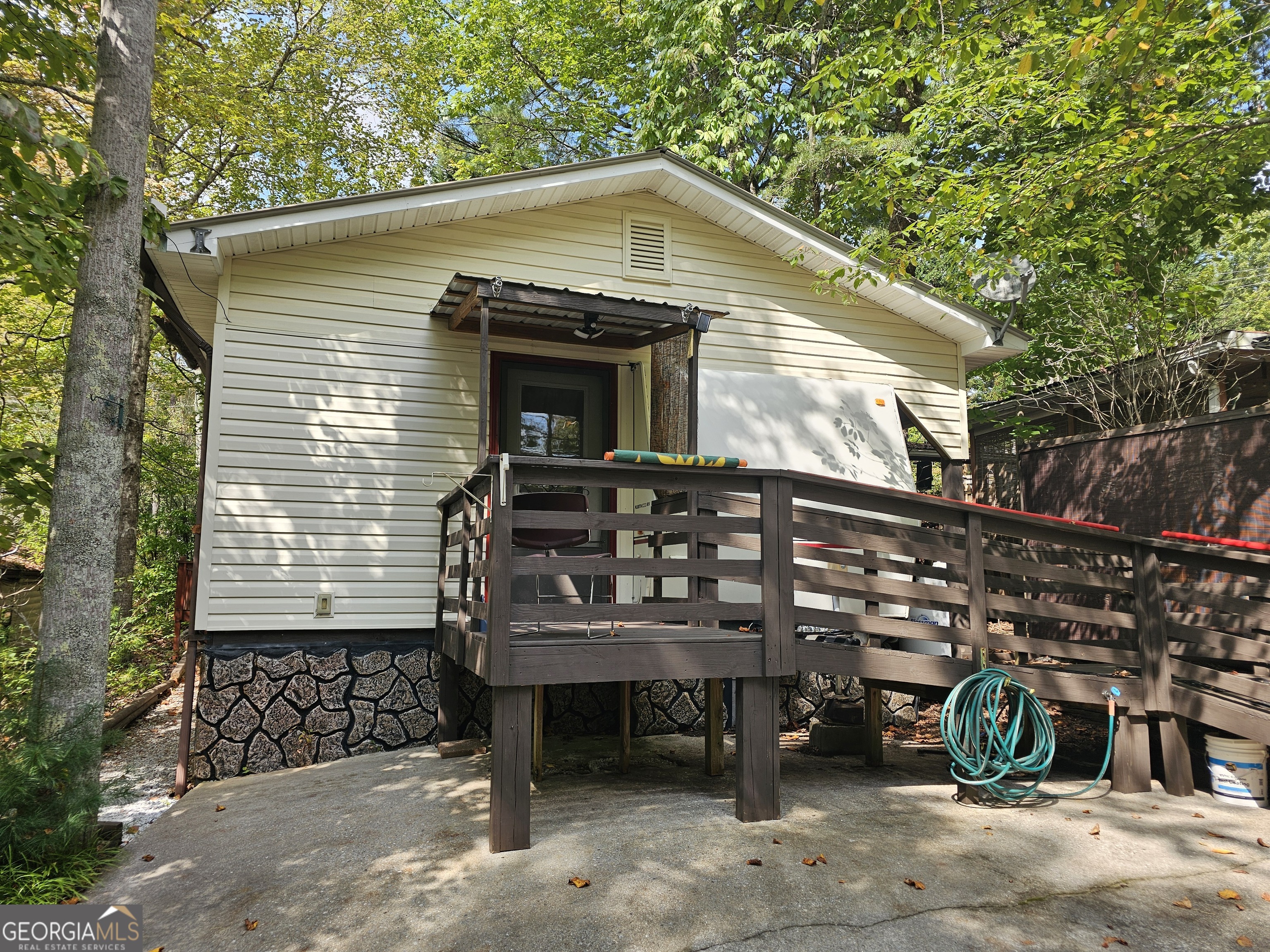 Escape to your own mountain getaway or Live Full time! This charming 3-bedroom, 1.5-bath retreat is tucked inside a scenic lake resort community offering the perfect blend of adventure and relaxation. Enjoy days filled with horseback riding, swimming, and kayaking right outside your door. Inside, you'll find a cozy living space, perfect for family and friends after a day on the trails or water. The home features a kitchen, comfortable bedrooms, and plenty of natural light. Whether you're looking for a vacation home, weekend escape this property offers endless possibilities in a resort setting with year-round aactivities. Fully Furnished and Owner Financing available.