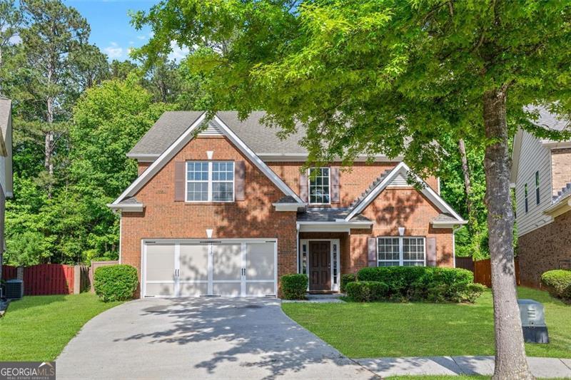 Welcome to this beautifully updated residence situated on a quiet cul-de-sac in the highly desirable and rarely available Killians Pond community. This meticulously maintained home offers a spacious open-concept & cozy layout, featuring a dramatic two-story foyer adorned with a stunning new chandelier that sets an elegant tone from the moment you enter. The main & upper level showcases refinished hardwood flooring throughout, recently painted interiors, and updated designer light fixtures, including a striking new crystal chandelier in the formal & separate dining room-perfect for sophisticated entertaining. The expansive kitchen boasts beautiful white cabinetry, granite countertops, tile backsplash, a large center island and a bright breakfast area leading you to the spacious, open yard. The family room is warm and inviting with a fireplace and abundant room to entertain.. Upstairs, the oversized primary suite includes a comfortable sitting area, a generous walk-in closet, and a spa-inspired bath with double vanities, a soaking tub, and a separate shower. Three additional spacious bedrooms and a full bath provide ample space for family or guests. Enjoy peace and privacy in the fully fenced, oversized backyard-serene and ideal for relaxing or entertaining outdoors. Located in a quiet, established neighborhood where homes seldom come on the market, this property offers both tranquility and convenience, just minutes from Hwy 78, shopping, and dining. This exceptional home is professionally cleaned, thoughtfully updated, and truly move-in ready. BRAND NEW flooring on main level just installed on June 25th, 2025. Home is virtually staged.